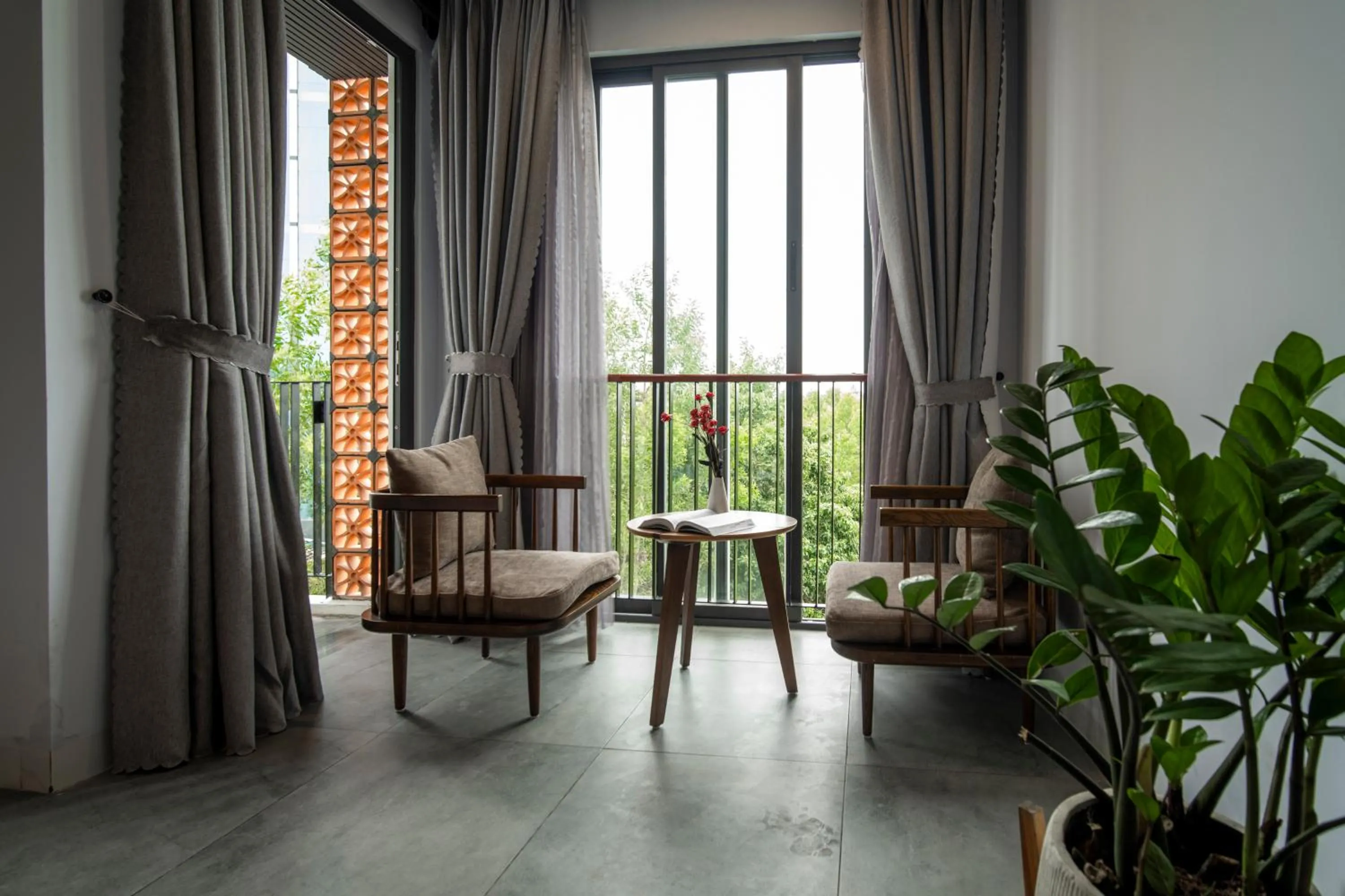 Seating area in DOMA by HSuites Hotel & Apartment