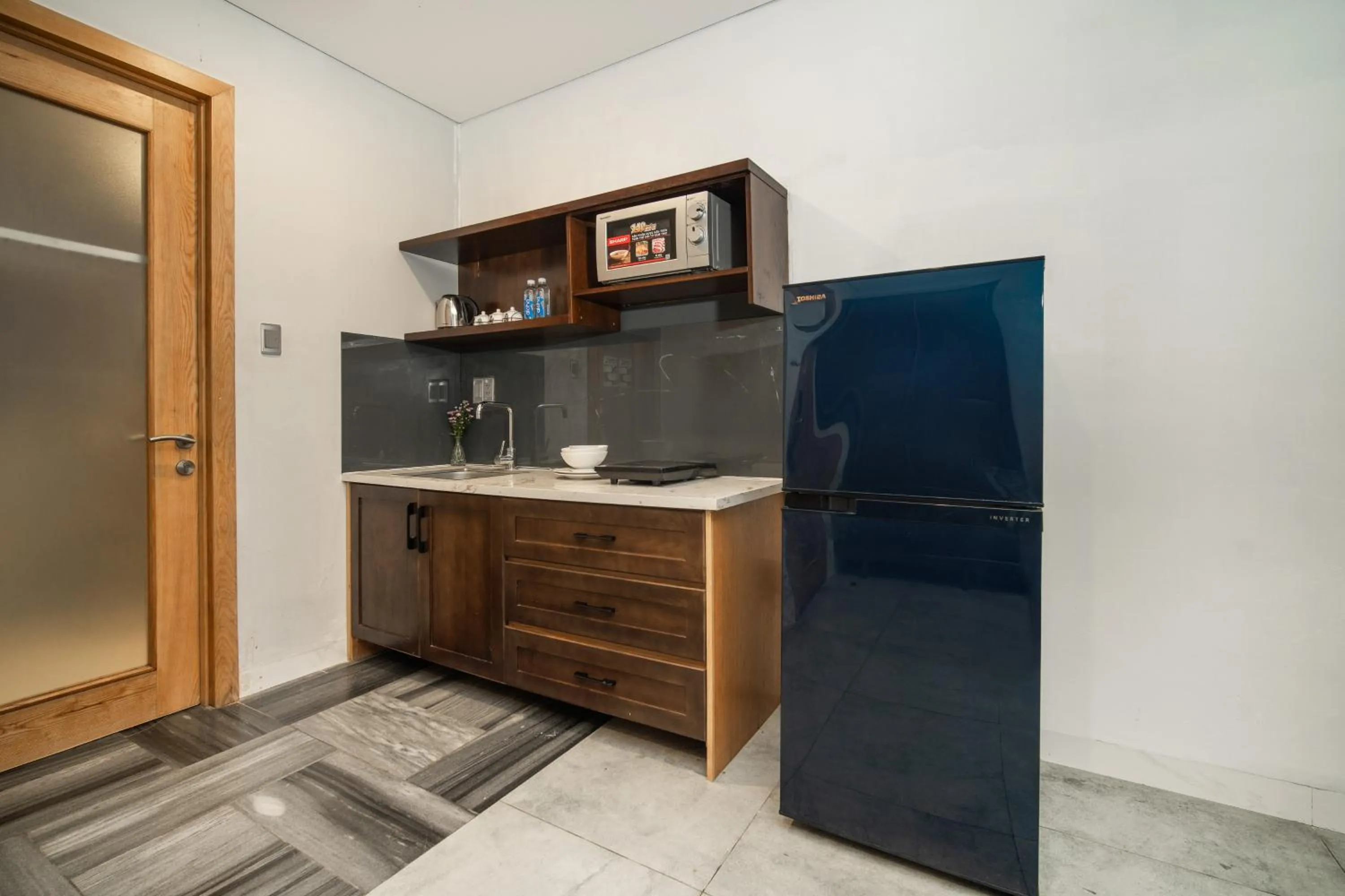 Kitchen or kitchenette in DOMA by HSuites Hotel & Apartment