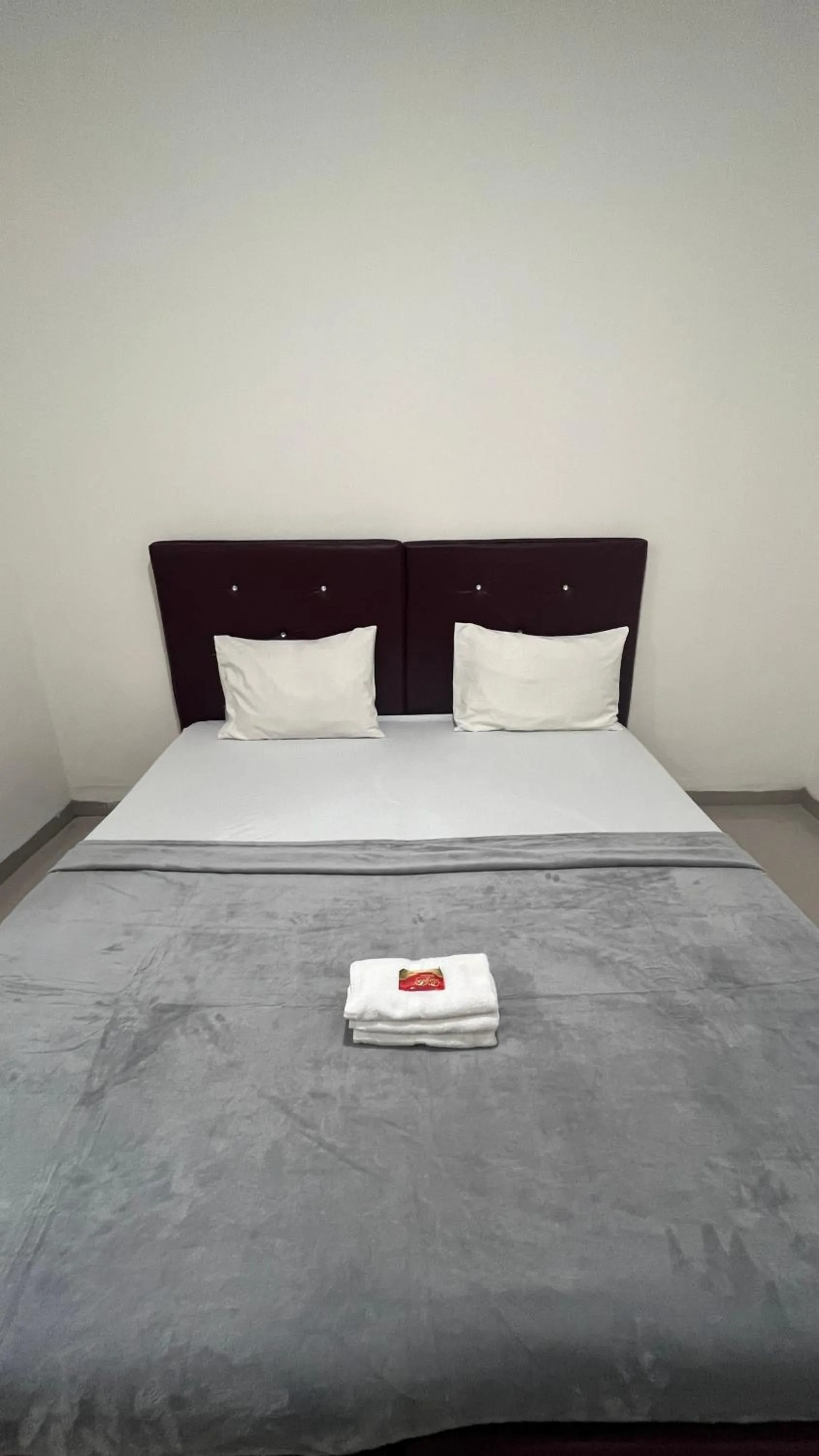 Bed in BI Hotel Kisaran