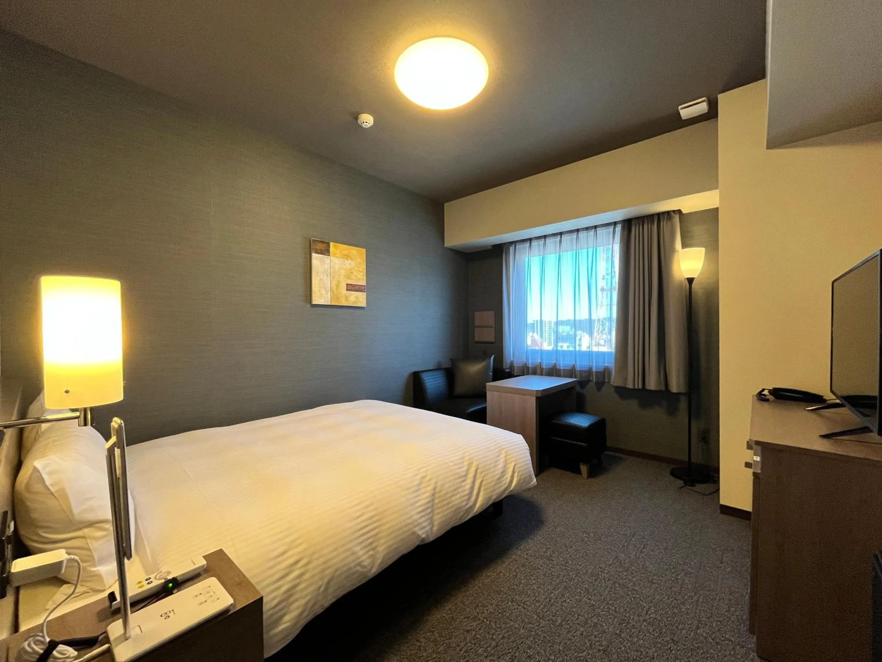 Photo of the whole room, Bed in Hotel Route Inn Grand Fukushima Ekimae Higashiguchi