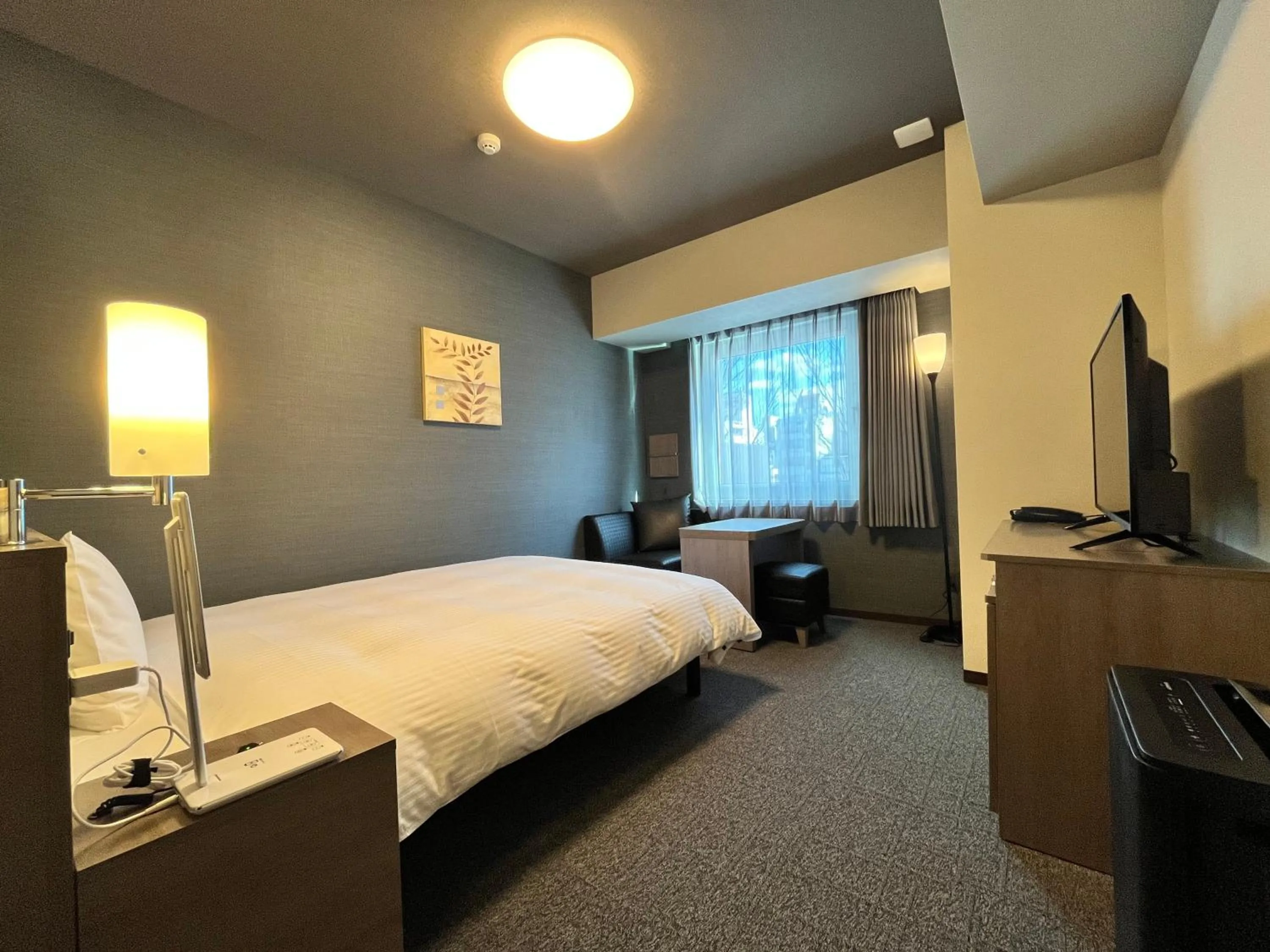 Photo of the whole room, Bed in Hotel Route Inn Grand Fukushima Ekimae Higashiguchi