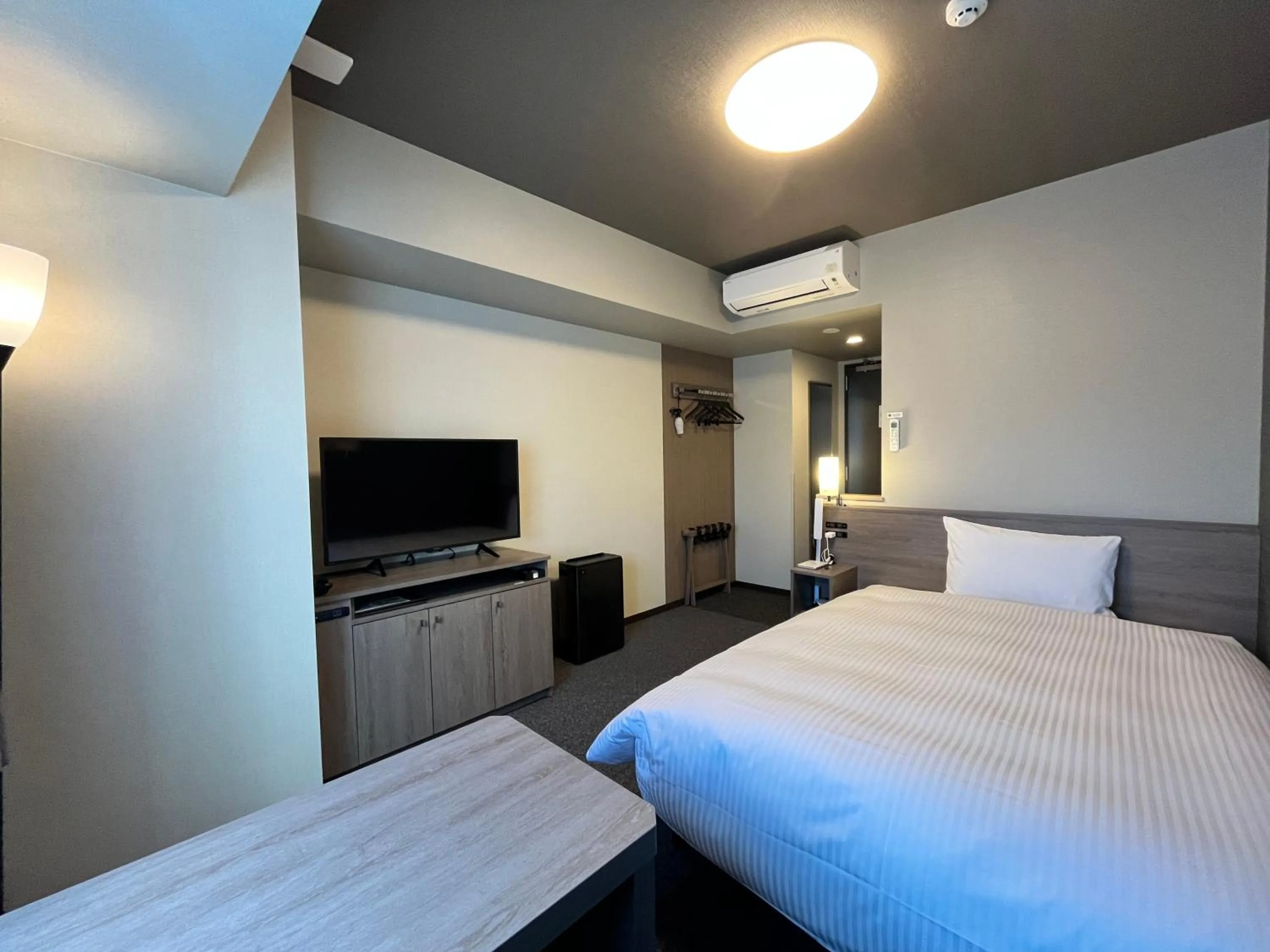 Photo of the whole room, Bed in Hotel Route Inn Grand Fukushima Ekimae Higashiguchi
