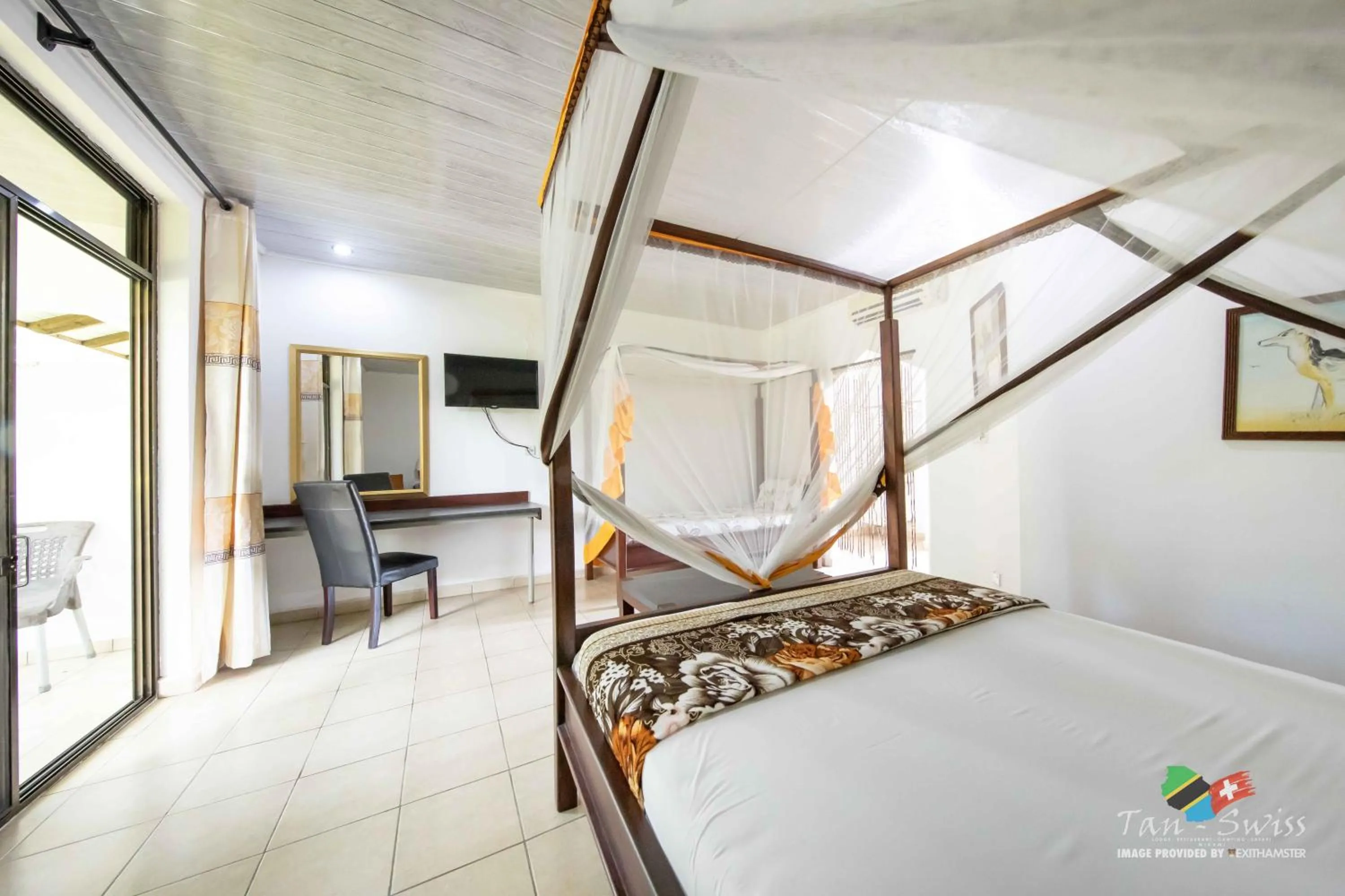 Photo of the whole room, Bed in Tan-Swiss Lodge