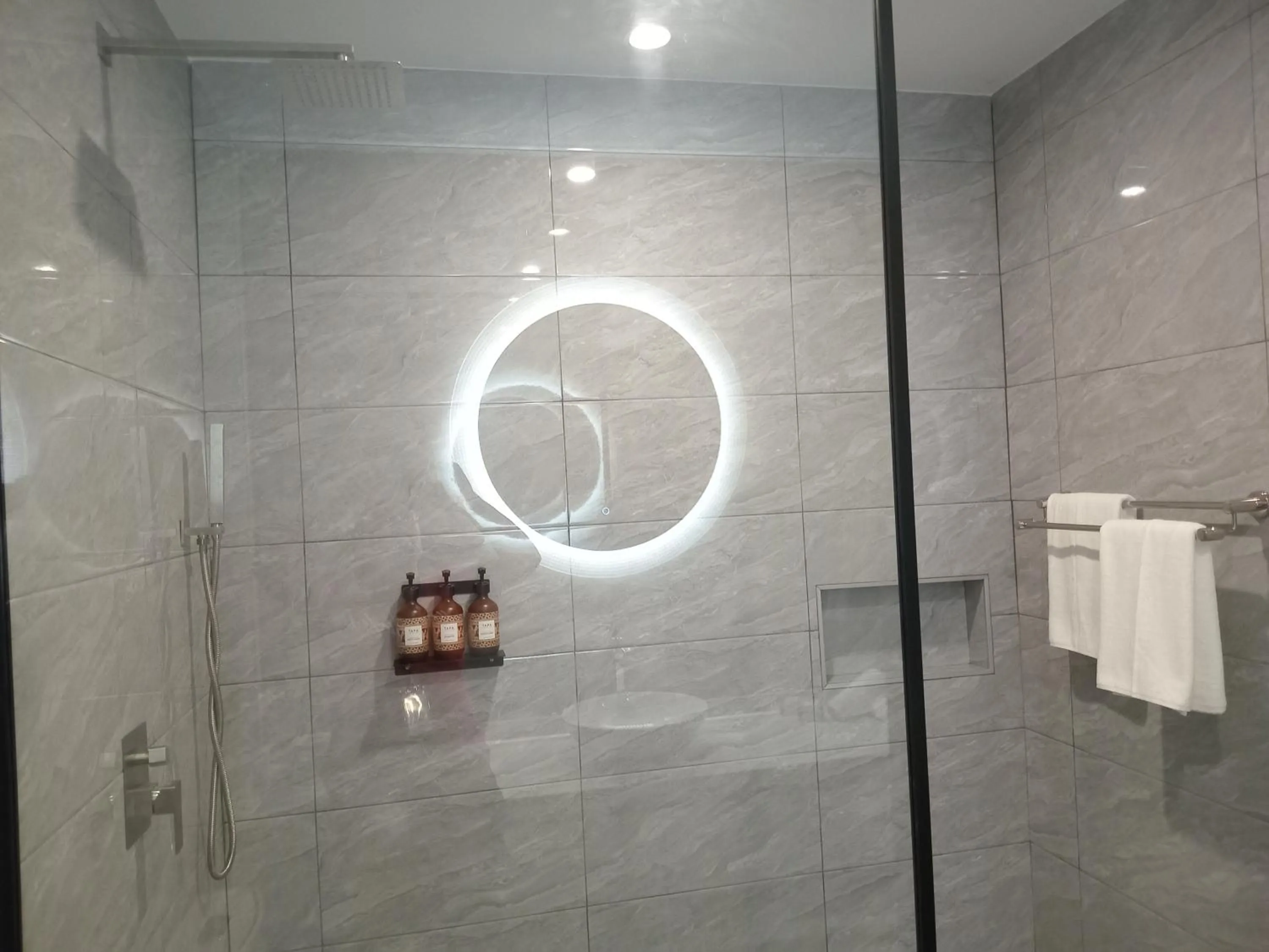 Shower in Hibiscus Suites And Residences