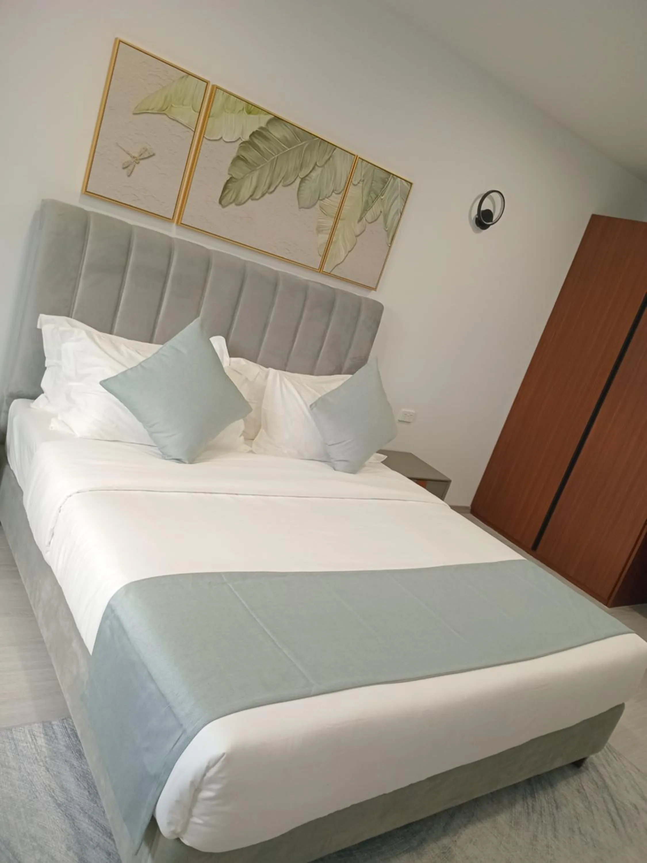 Bed in Hibiscus Suites And Residences