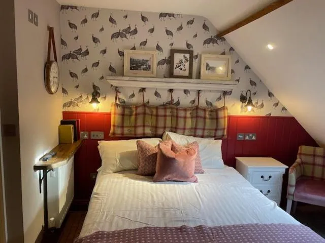 Bed in The Golden Pheasant Inn