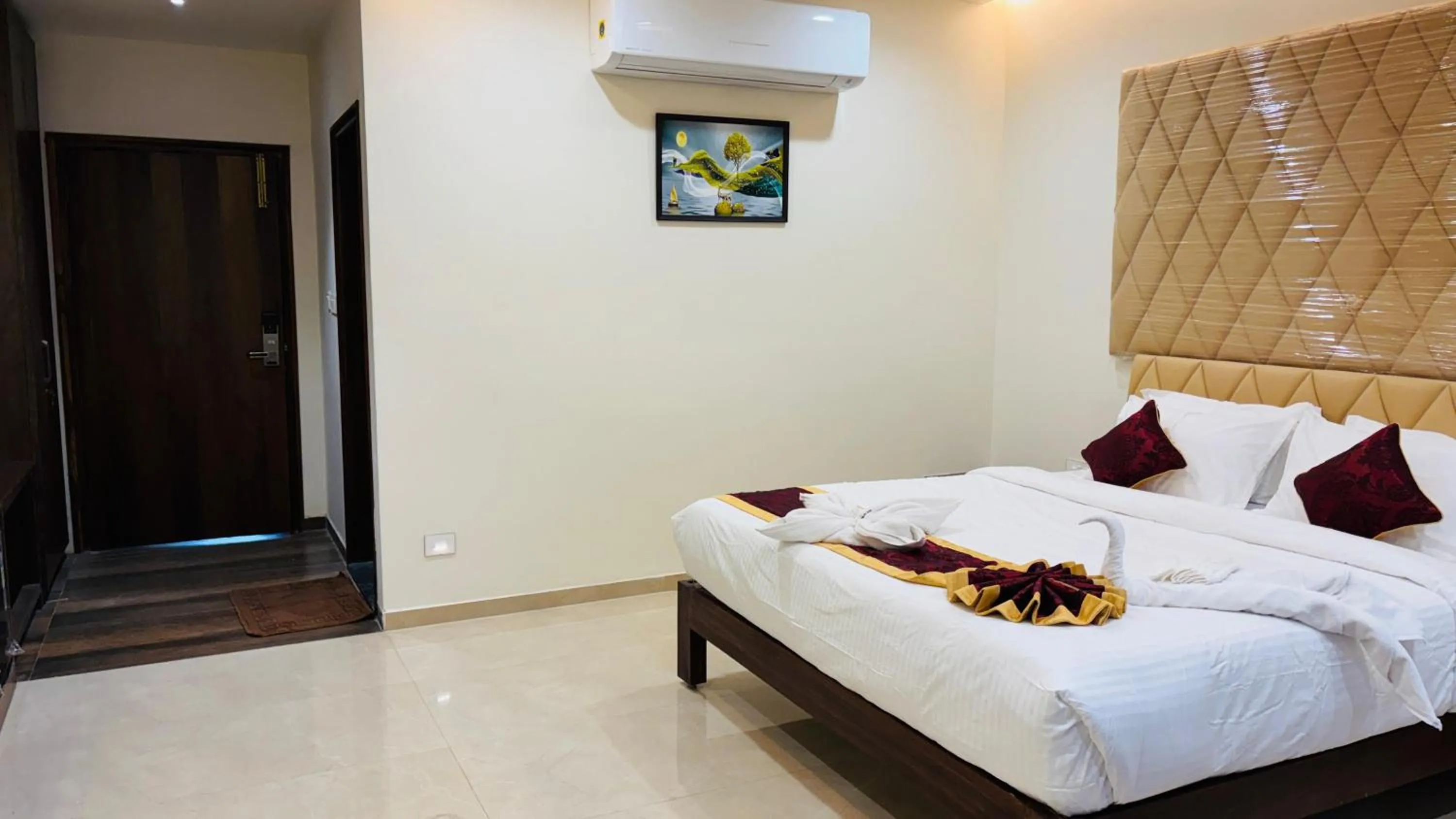 Bed in MK Naidu Hotel &Conventions Center