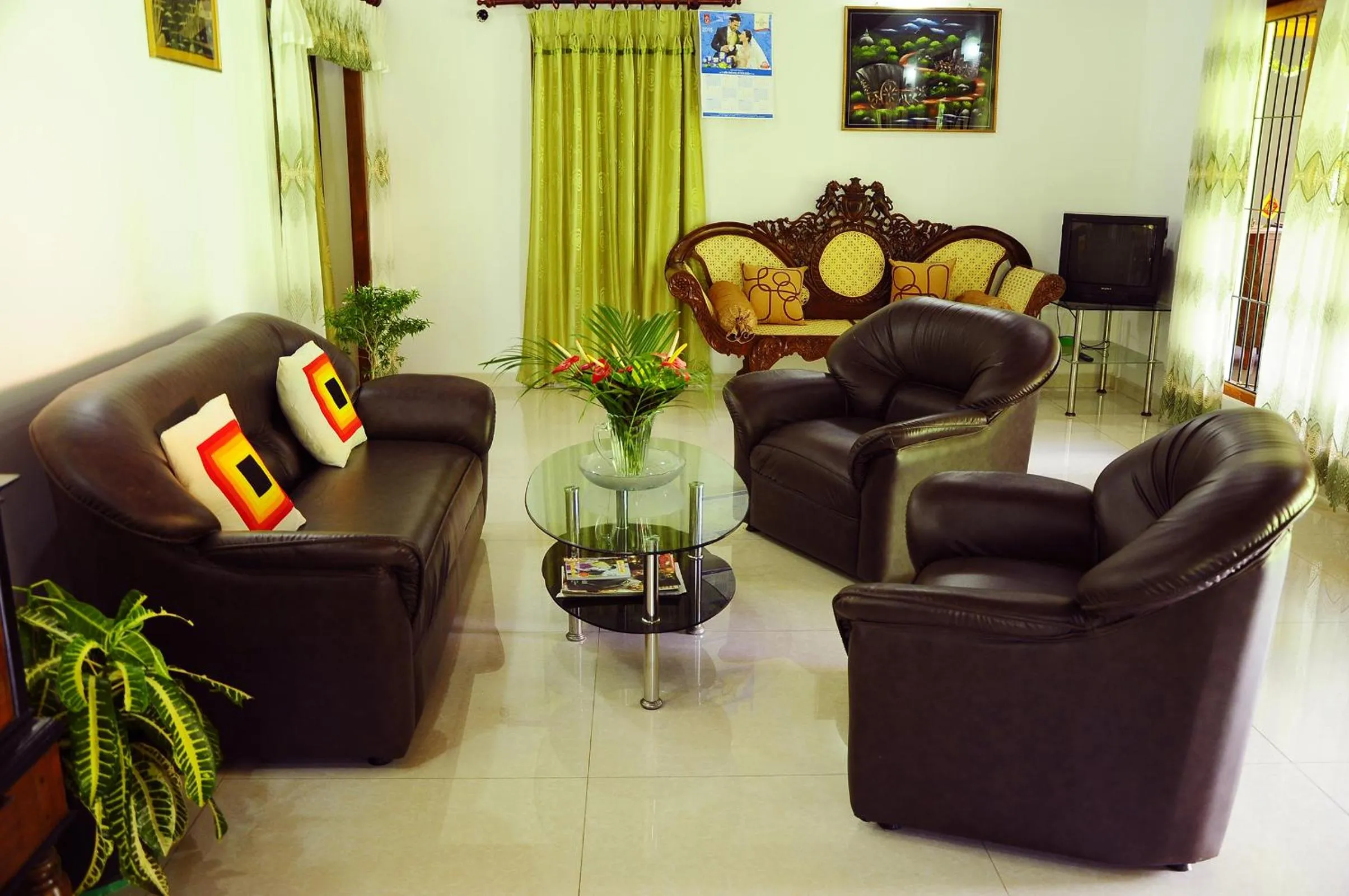 Communal lounge/ TV room in Lumbini Villa