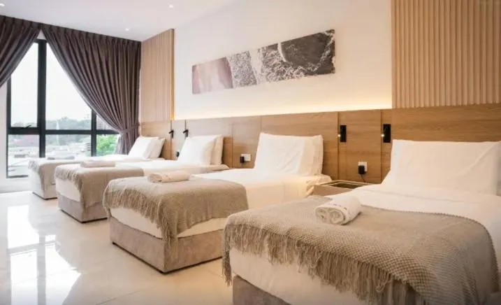 Comfort Quadruple Room in Inap II Suterabay By Ayuhouz