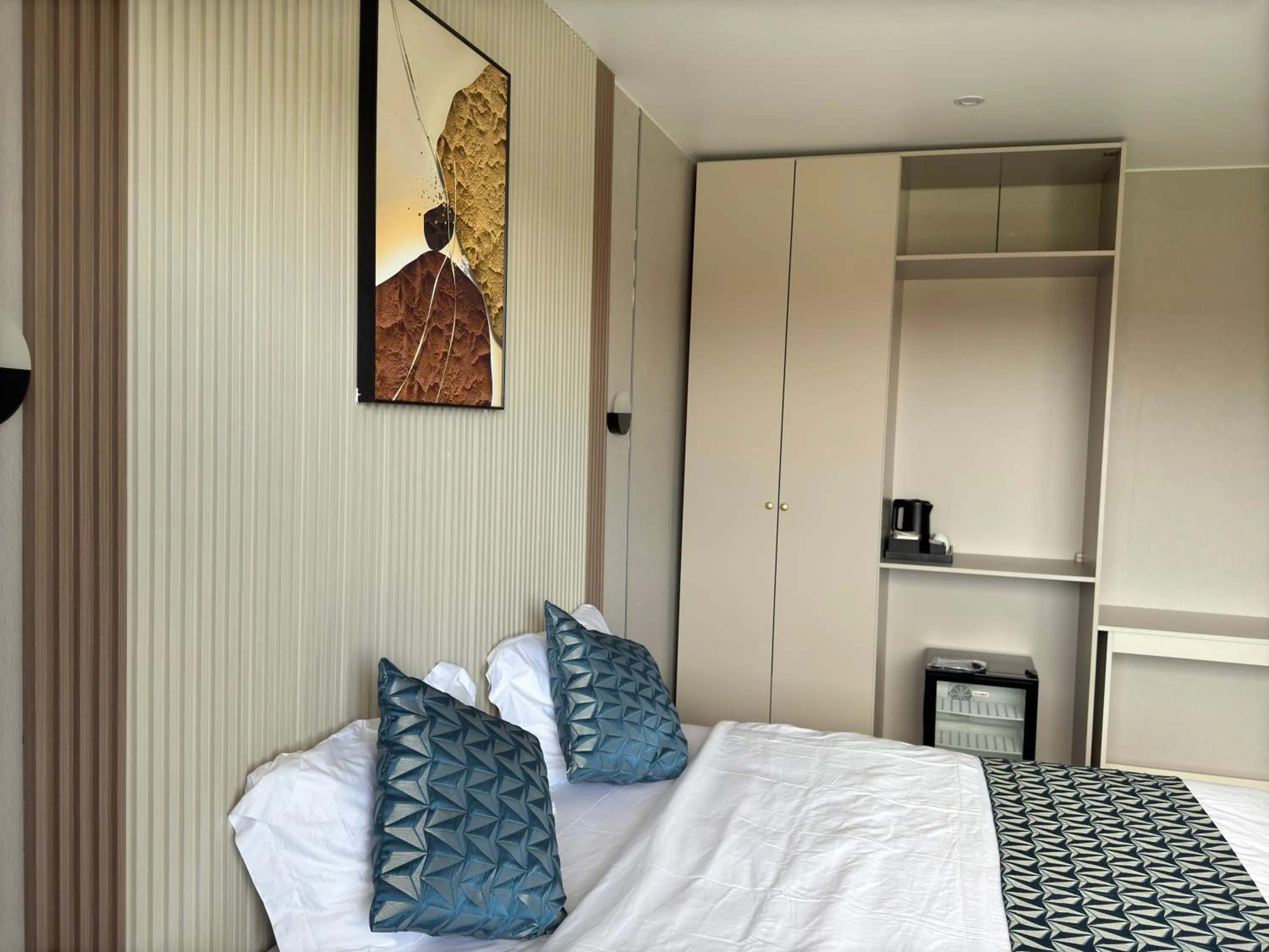 Bed in Taufusi Hotel