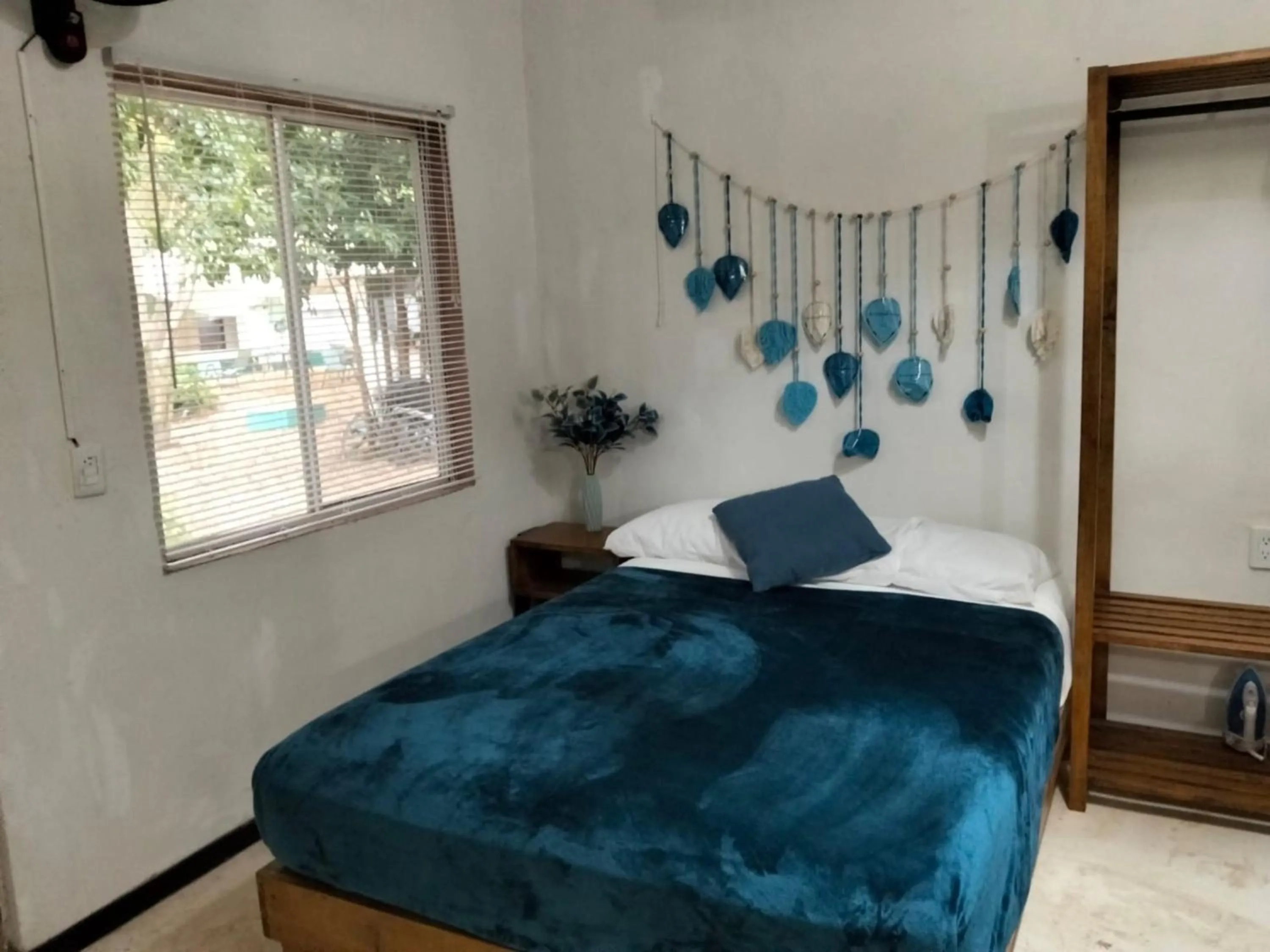 Bed in BACALAR INN Hotel