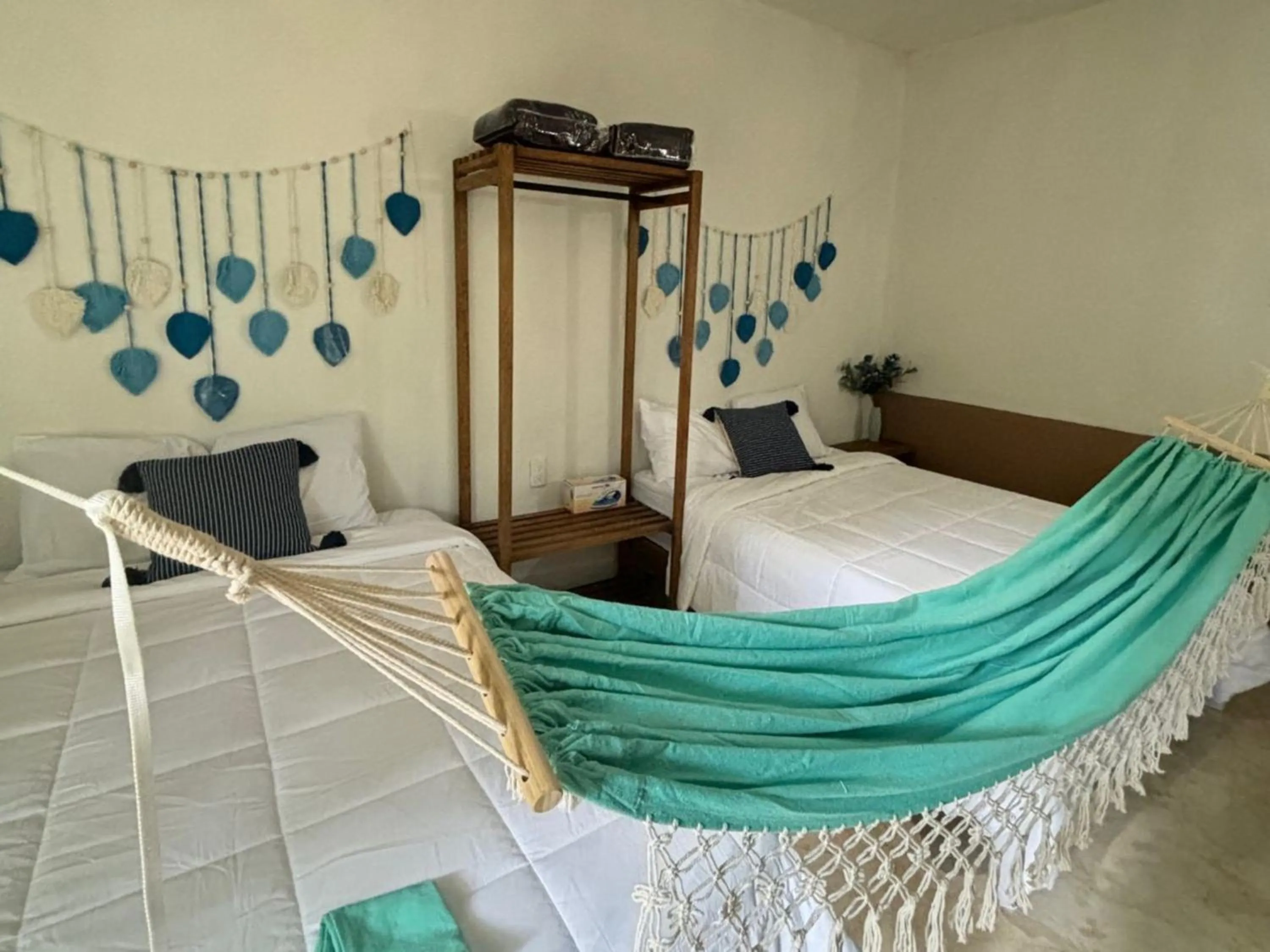 Bed in BACALAR INN Hotel