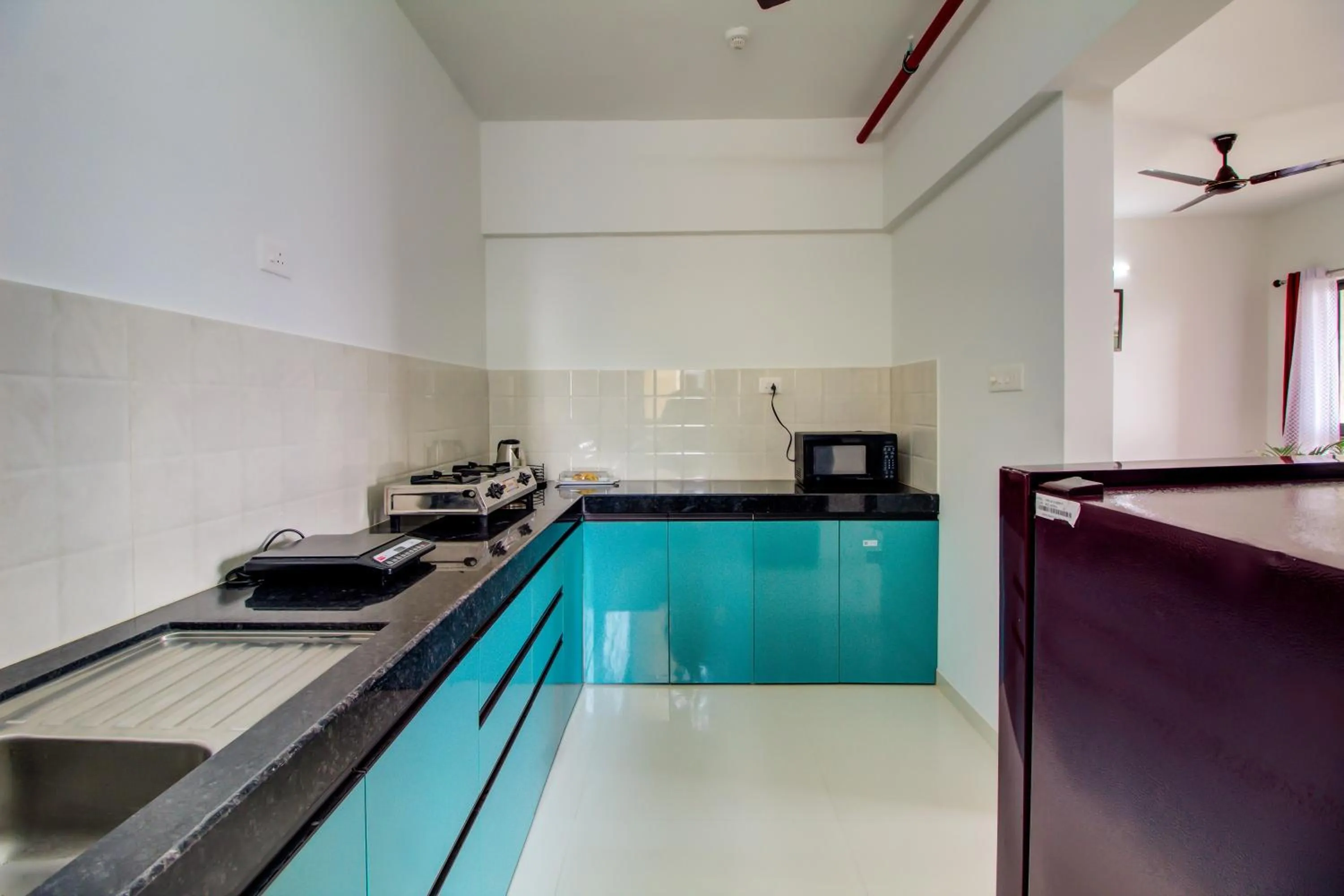 Kitchen or kitchenette in VibeStayZ Kedar Hinjewadi