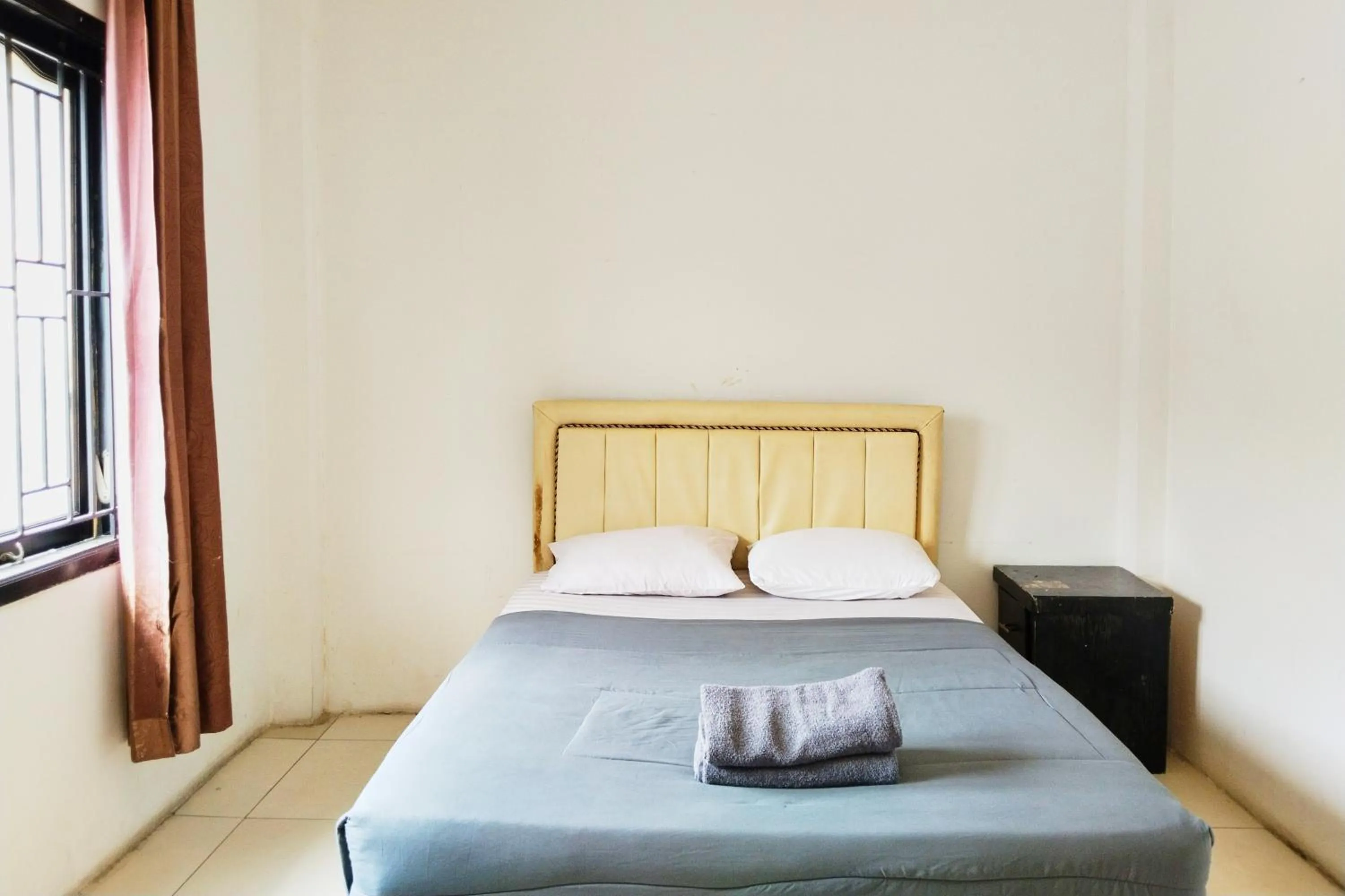 Bed in NamRoom at Kebayoran Baru