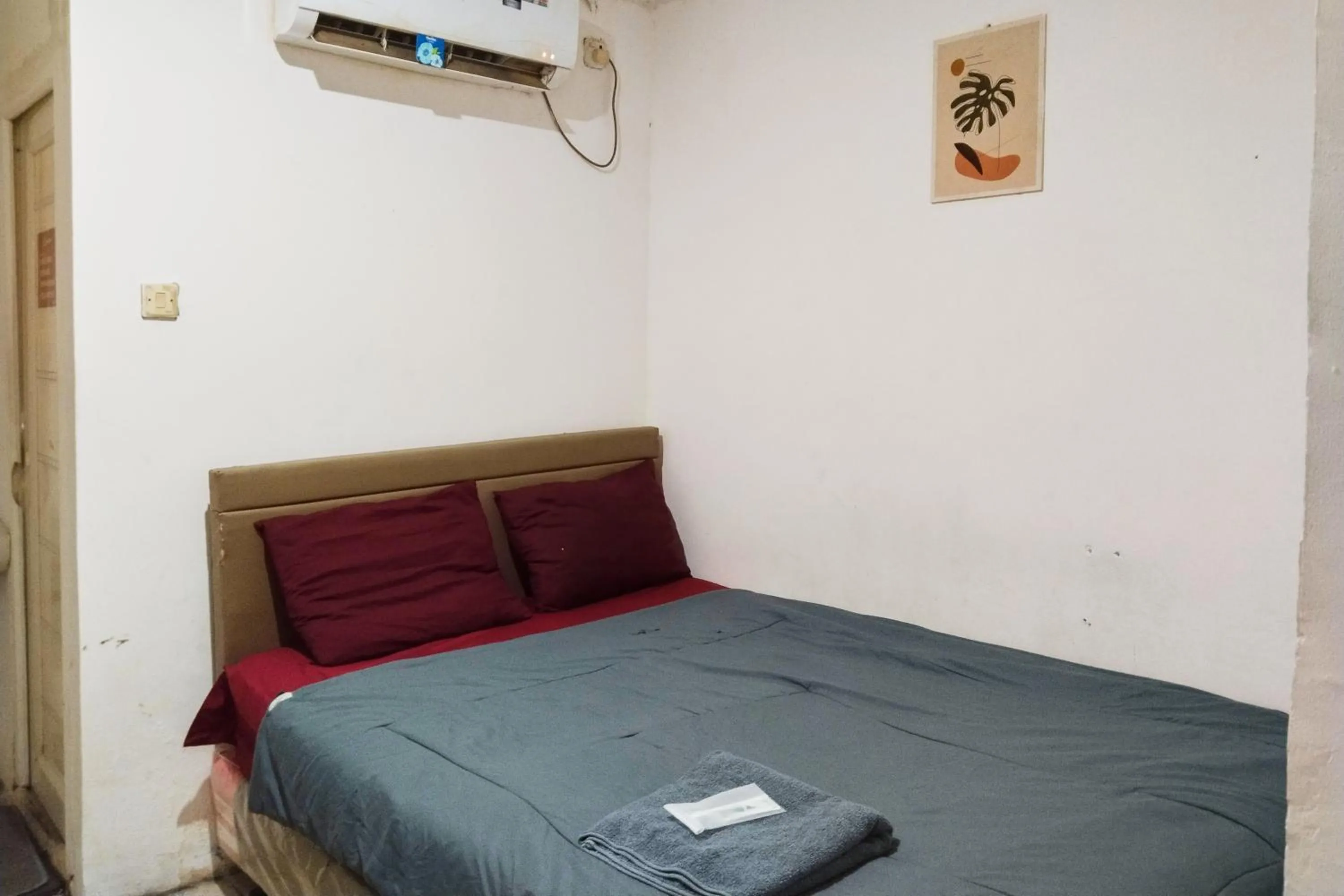 Bed in NamRoom at Kebayoran Baru