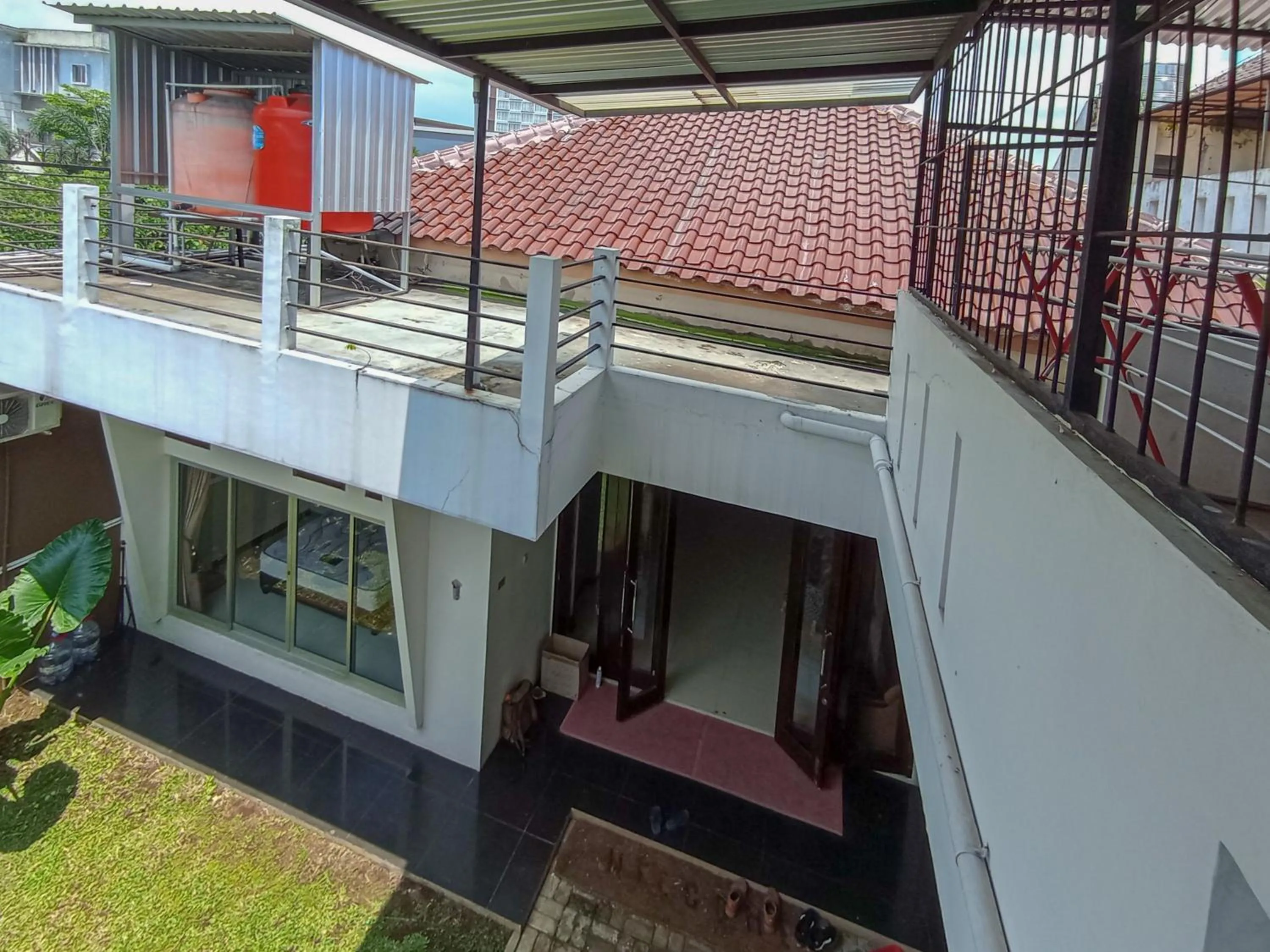 Facade/entrance in RedDoorz at Wisma Garden Purwokerto