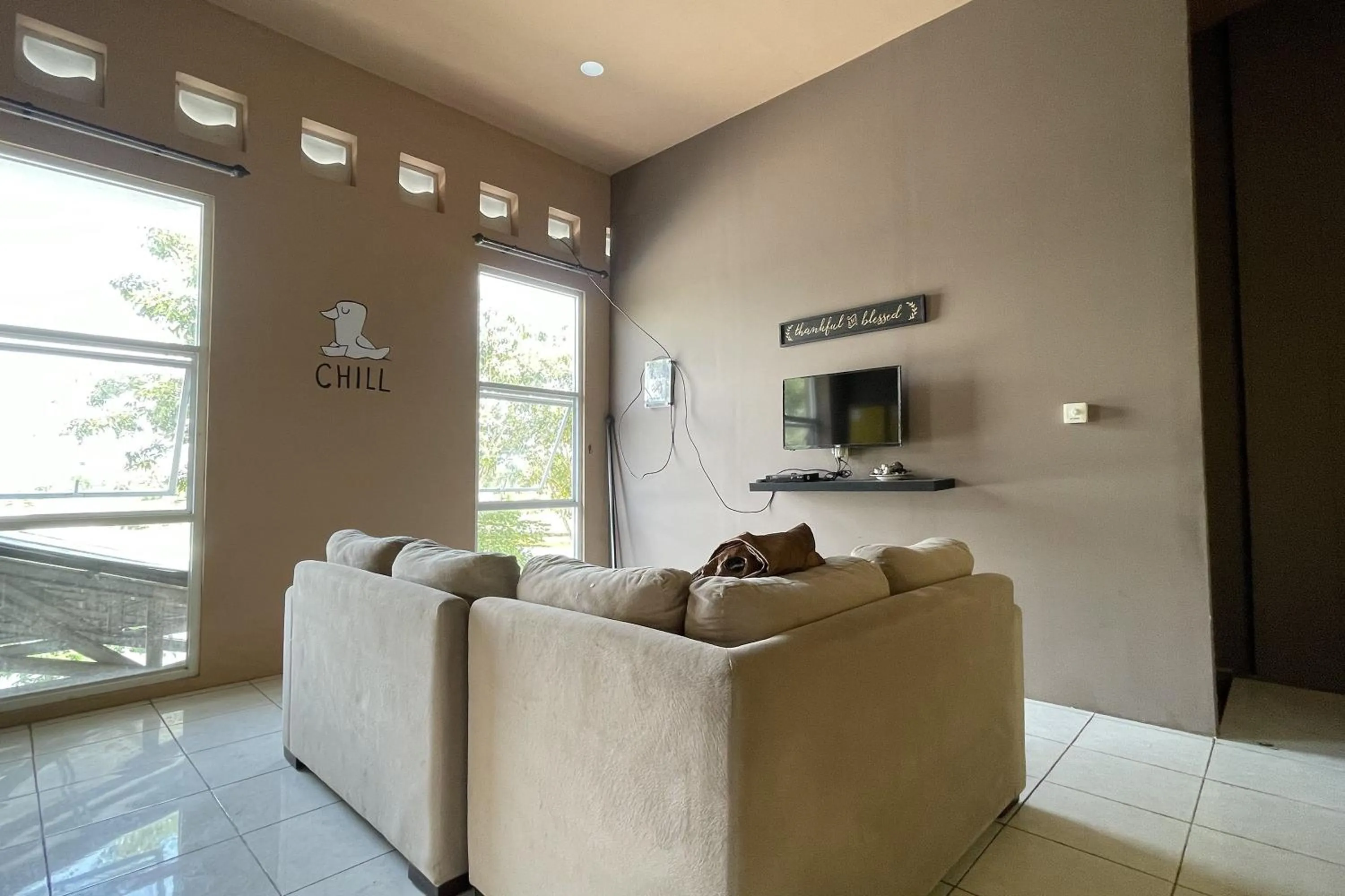 Communal lounge/ TV room in VK Pods Pangandaran