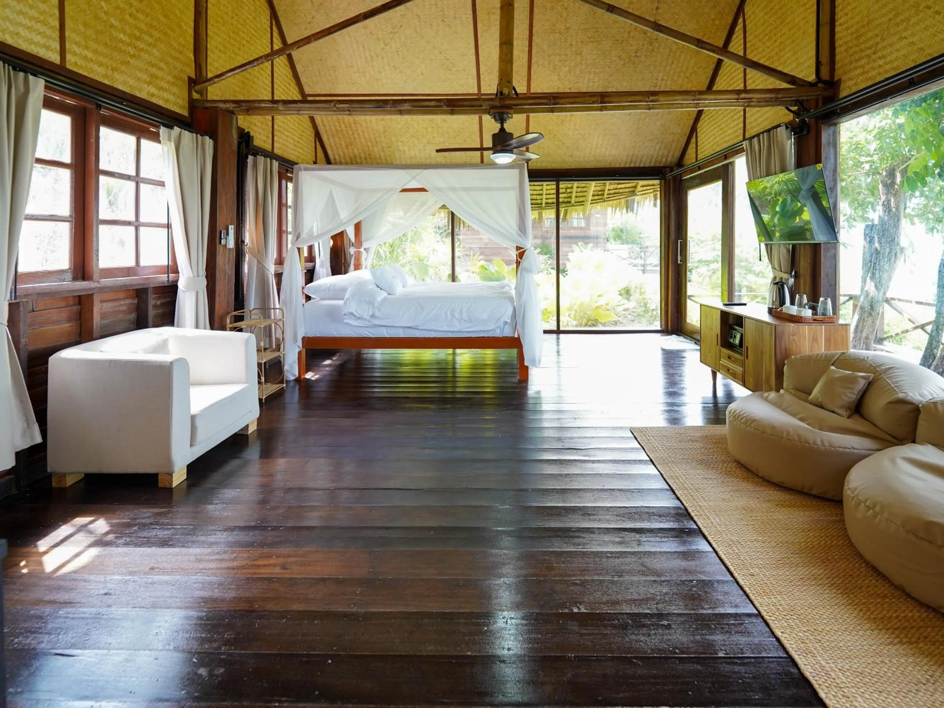 Living room in RoomQuest THEVA Resort Koh Samui