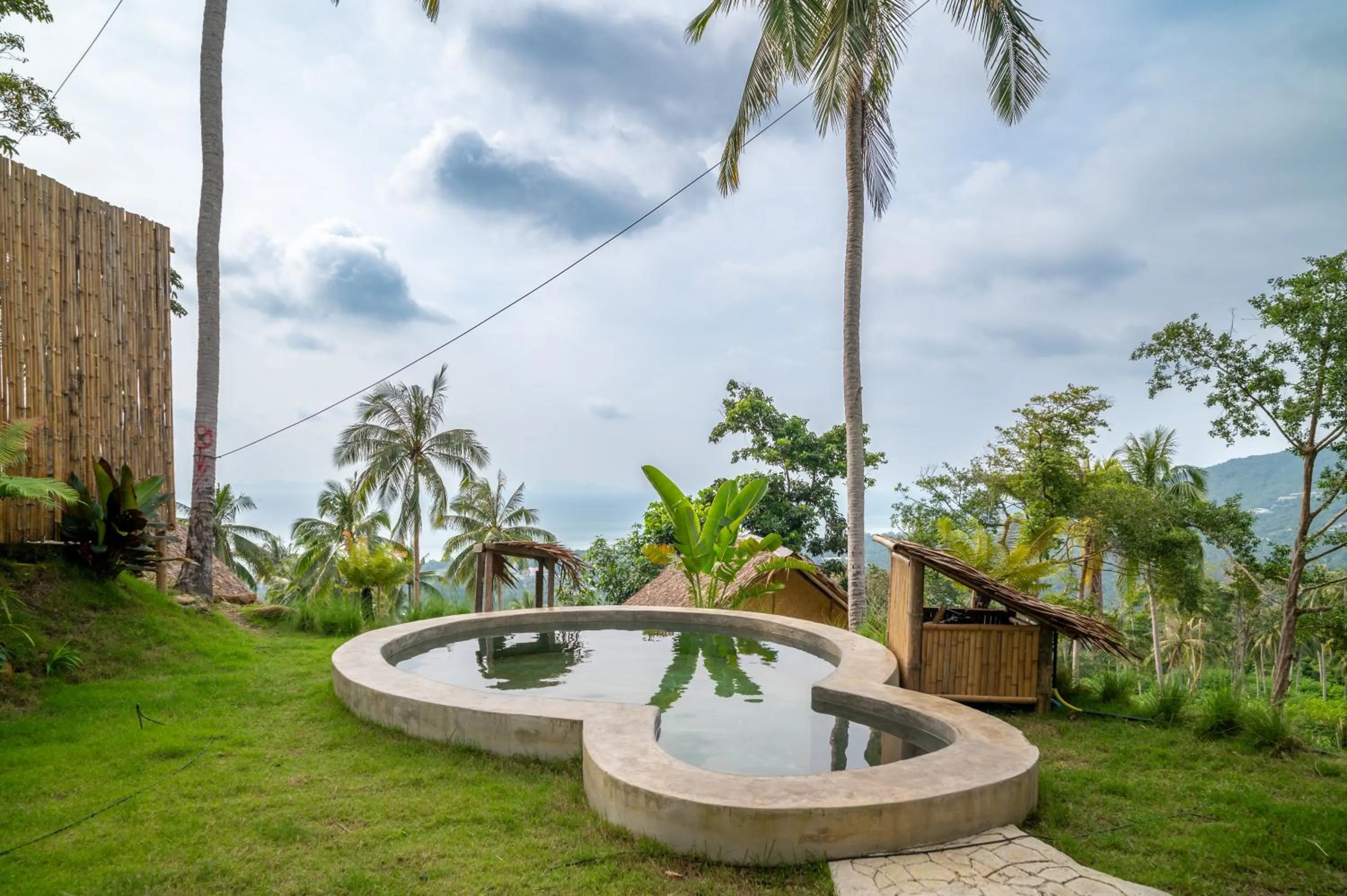 Pool view in RoomQuest THEVA Resort Koh Samui