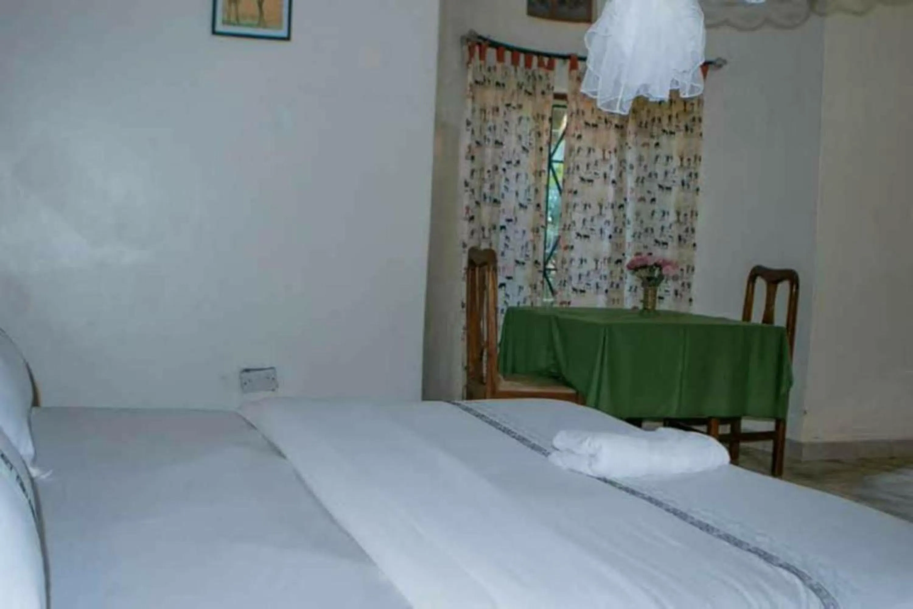 Bed in Gorilla African Guest House