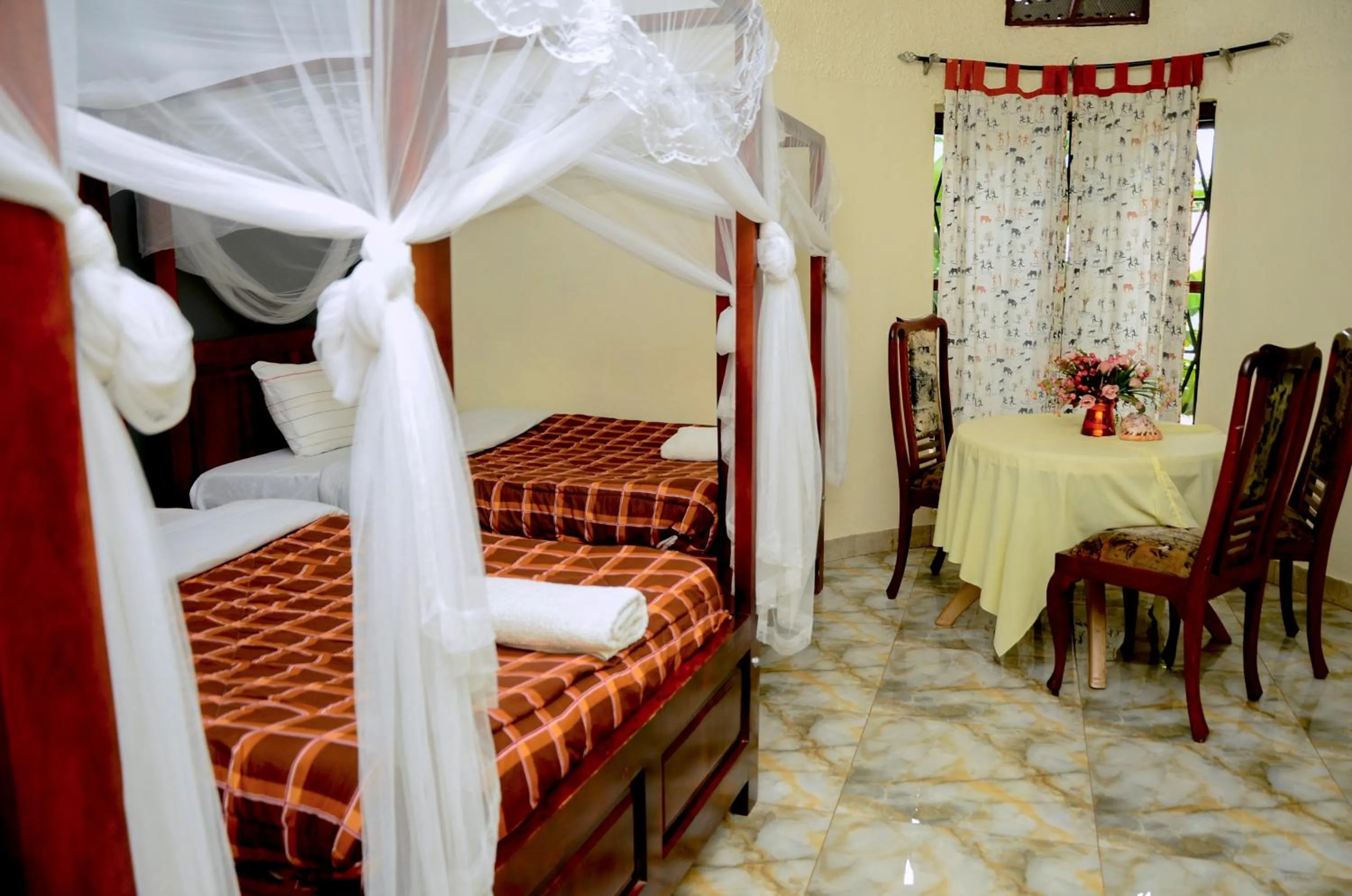 Bed in Gorilla African Guest House