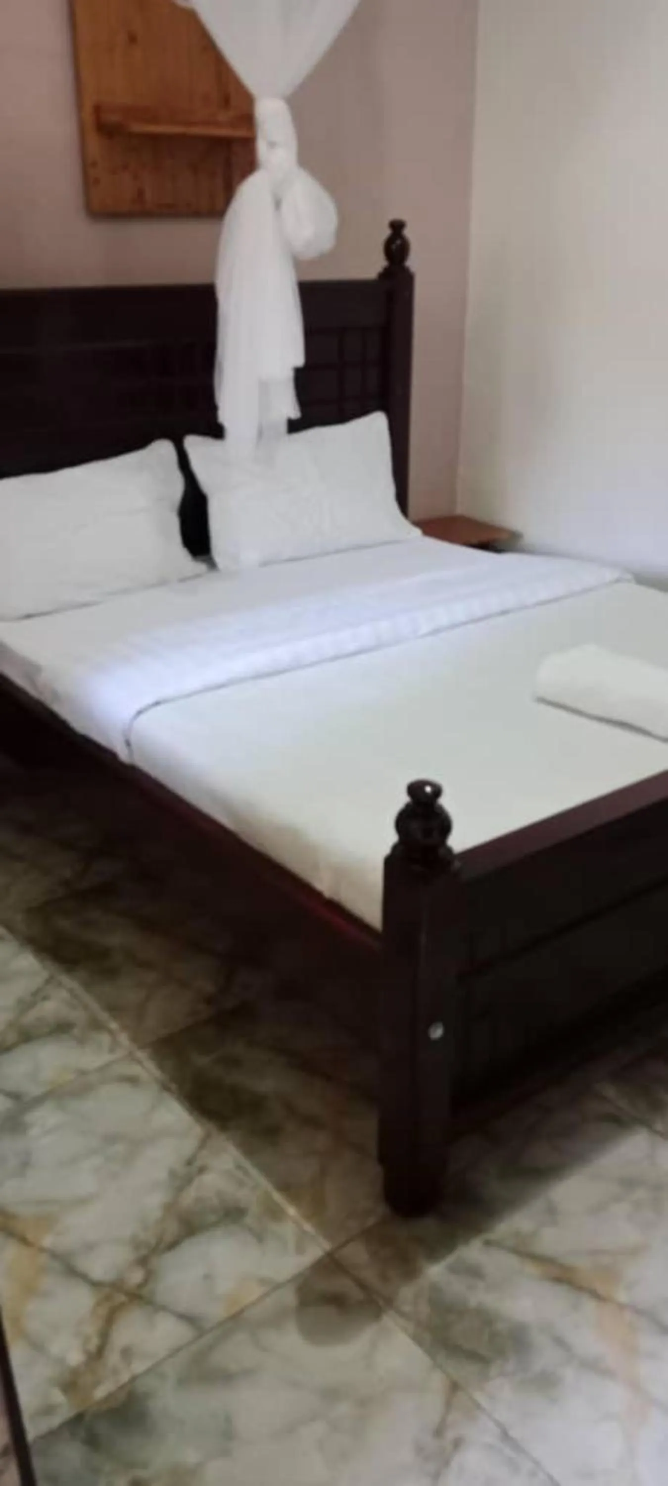 Bed in Gorilla African Guest House