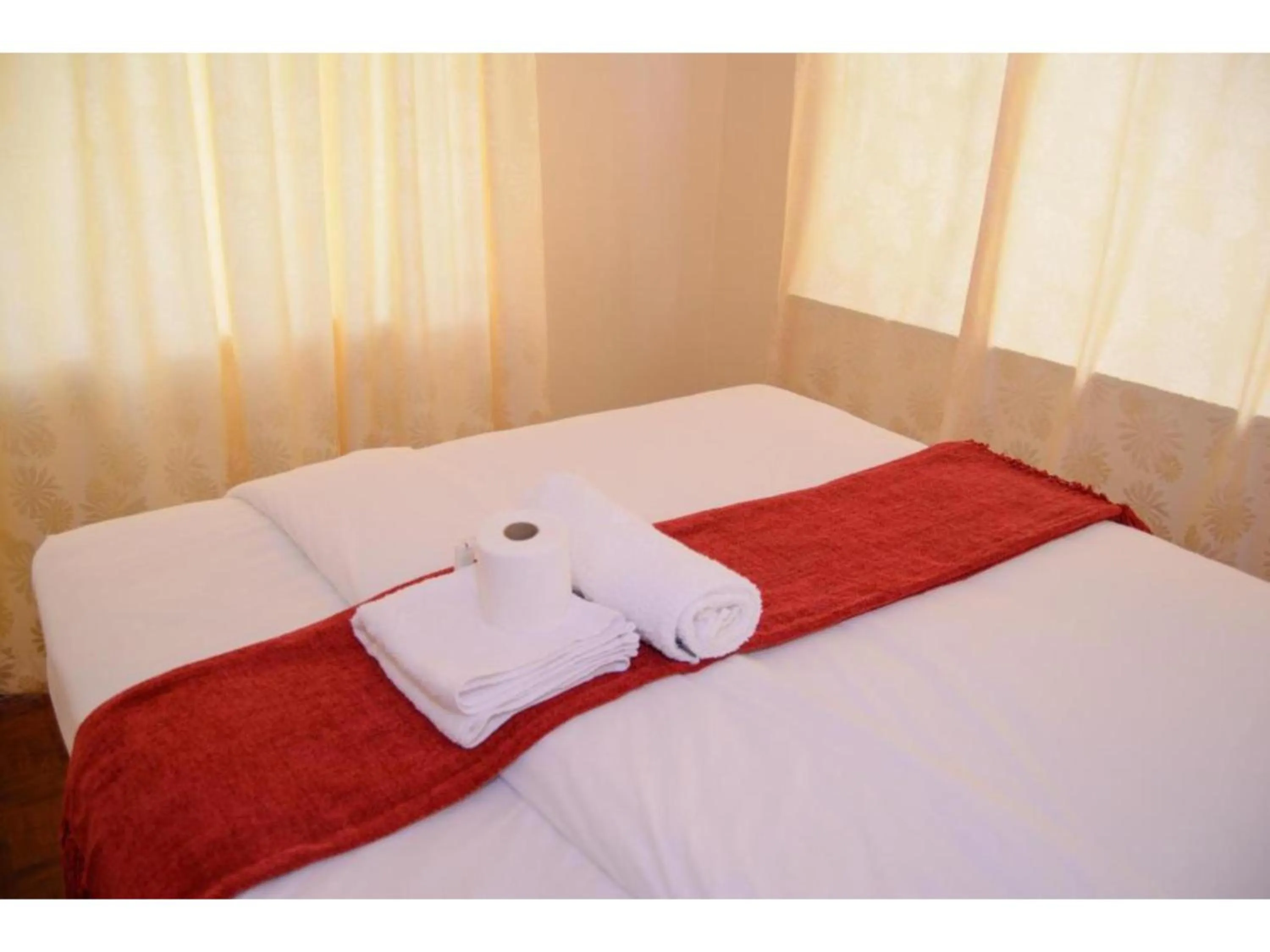 Bed in Gorilla African Guest House