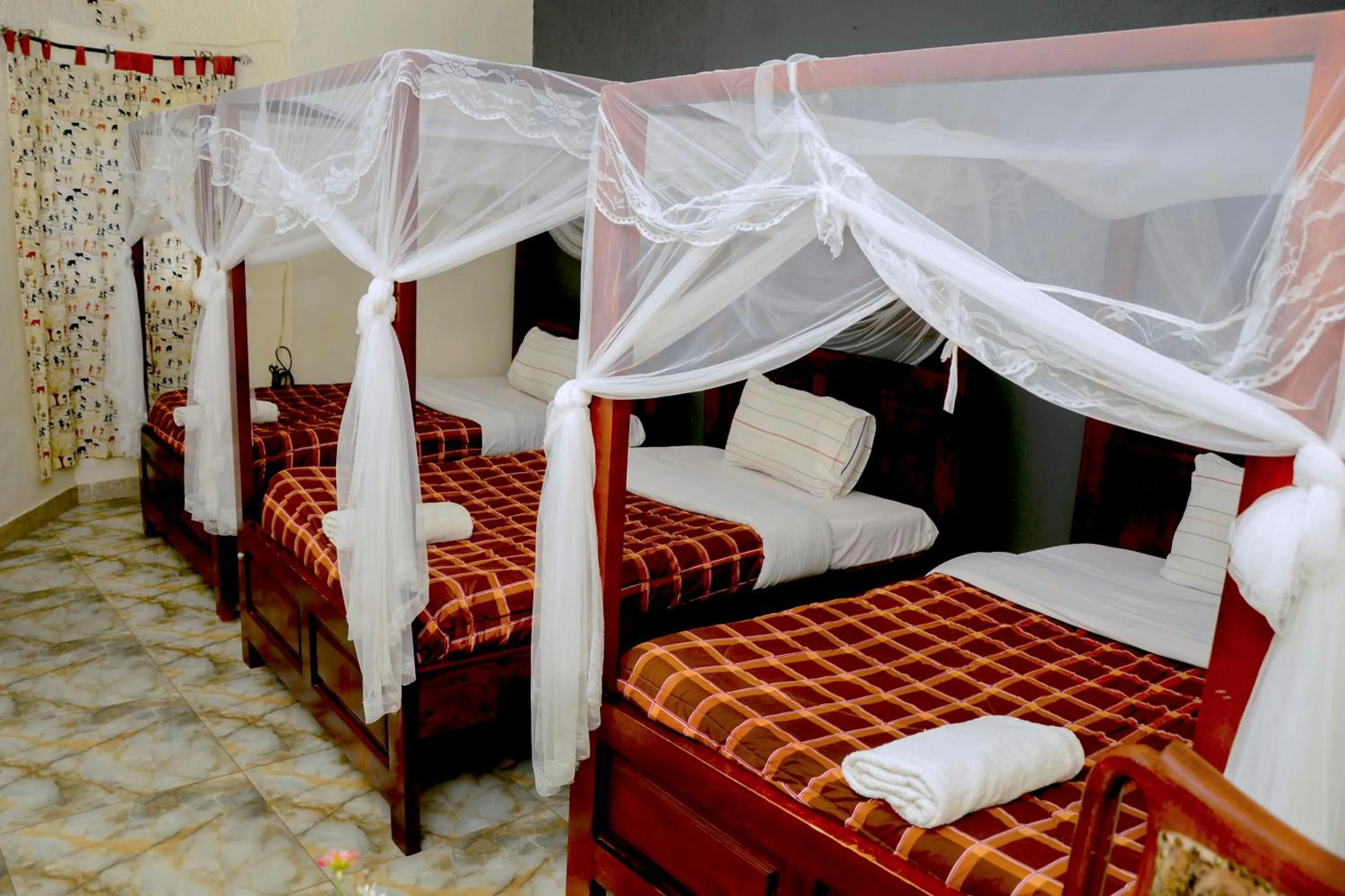 Bed in Gorilla African Guest House