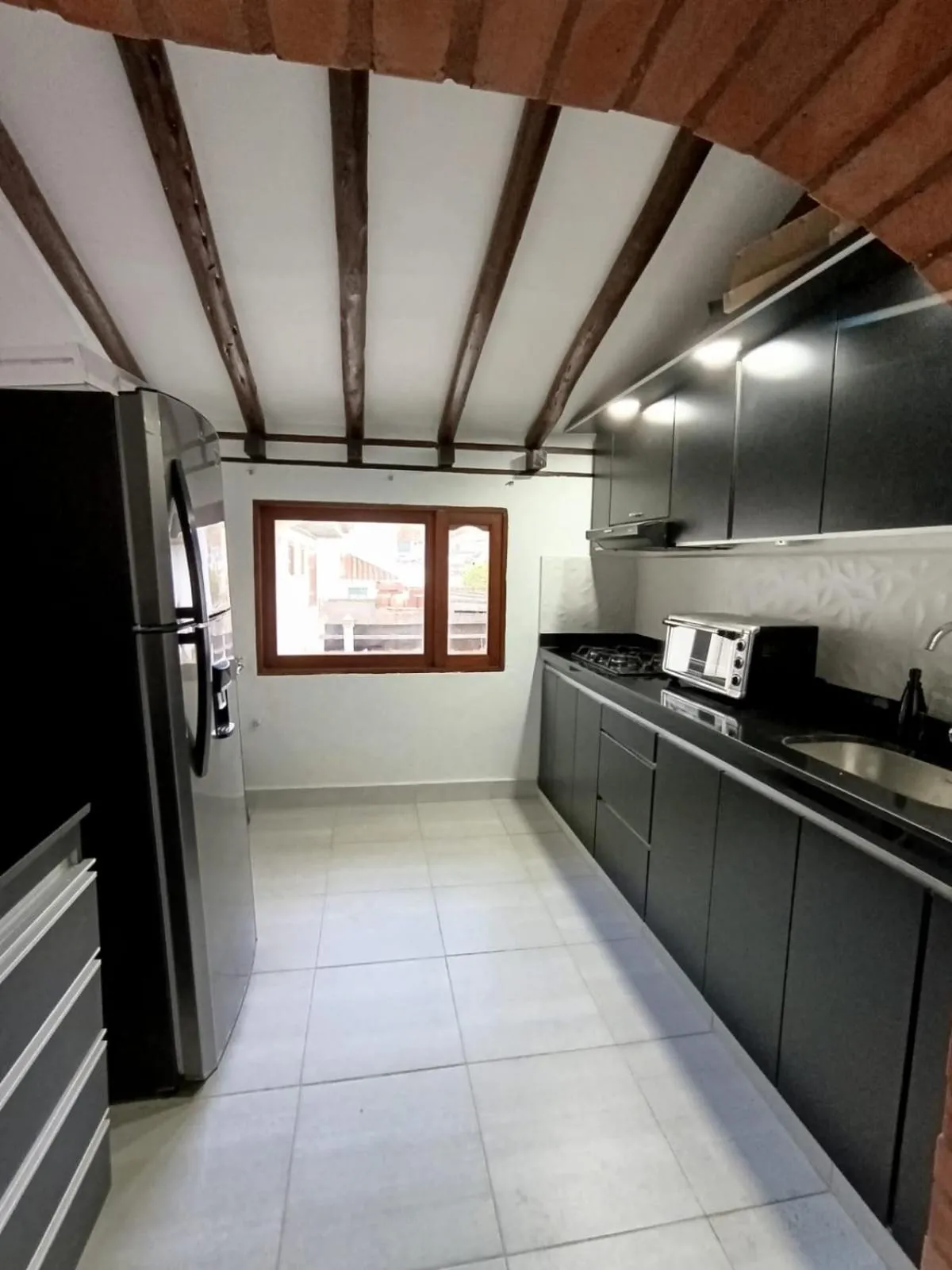 Kitchen or kitchenette in La Toscana Hostel