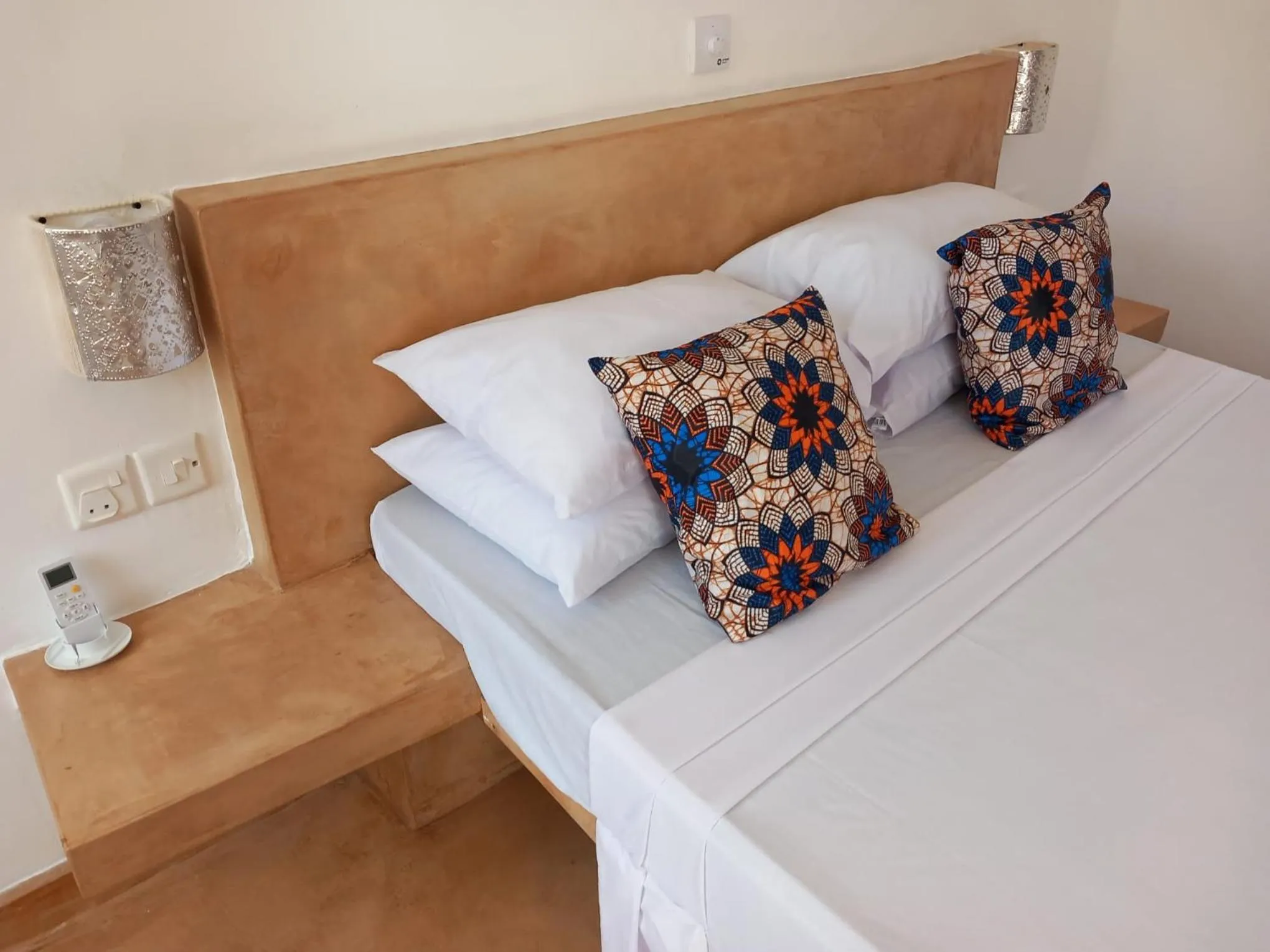 Bed in TATU INN Boutique Hotel WATAMU