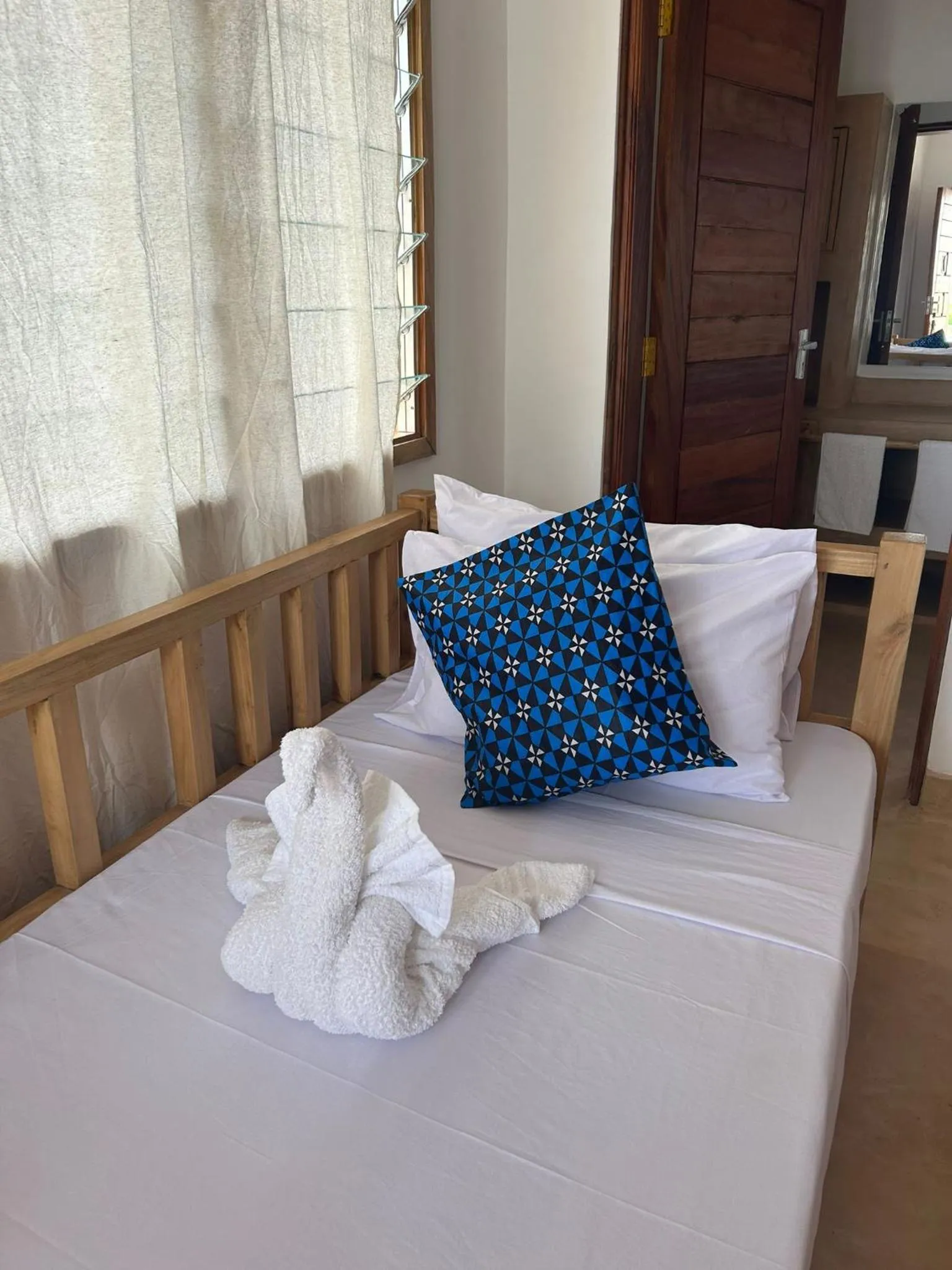 Bed in TATU INN Boutique Hotel WATAMU