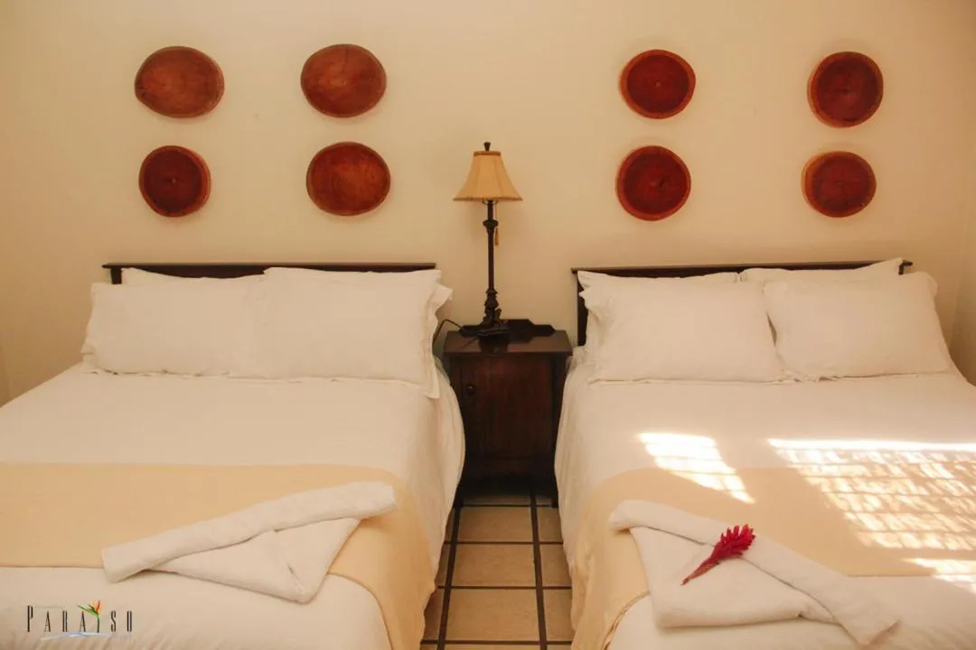 Bed in Paraiso Rainforest and Beach Hotel