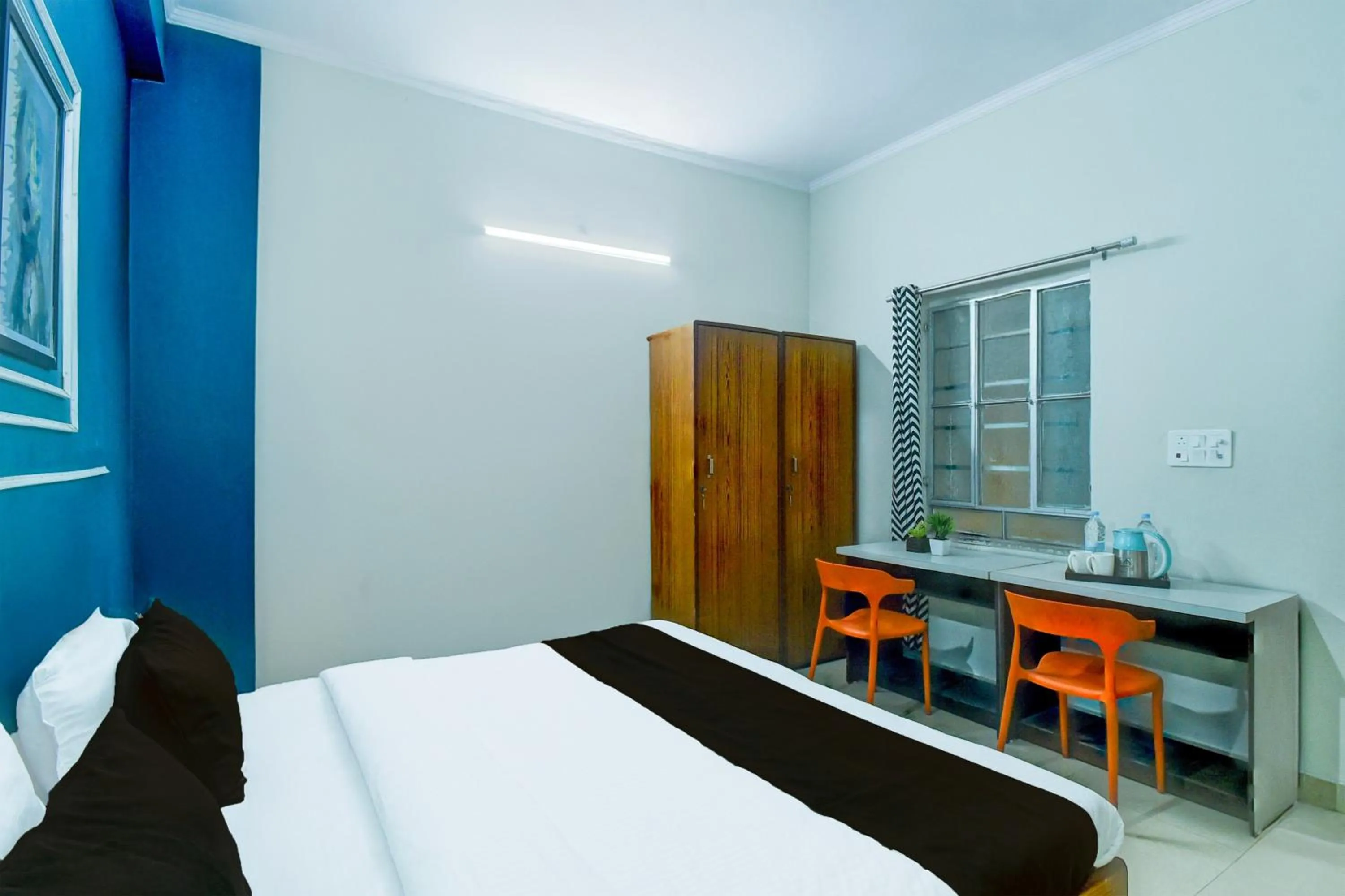 Bedroom in Hotel O SS