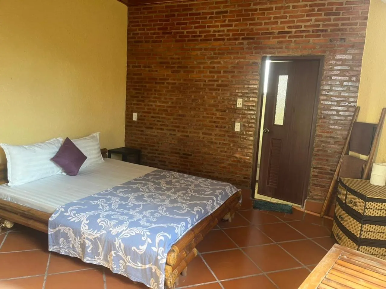 Bed in Ninila Fruit Farm Bungalow