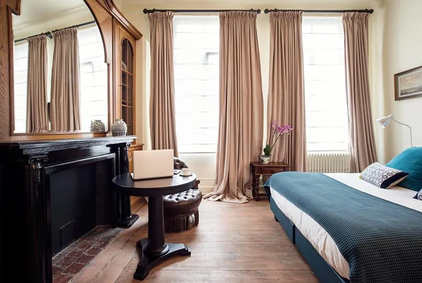 Bed in Ganda Rooms & Suites