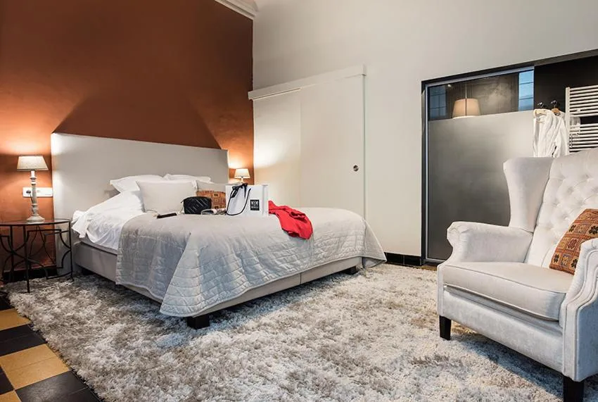 Bed in Ganda Rooms & Suites