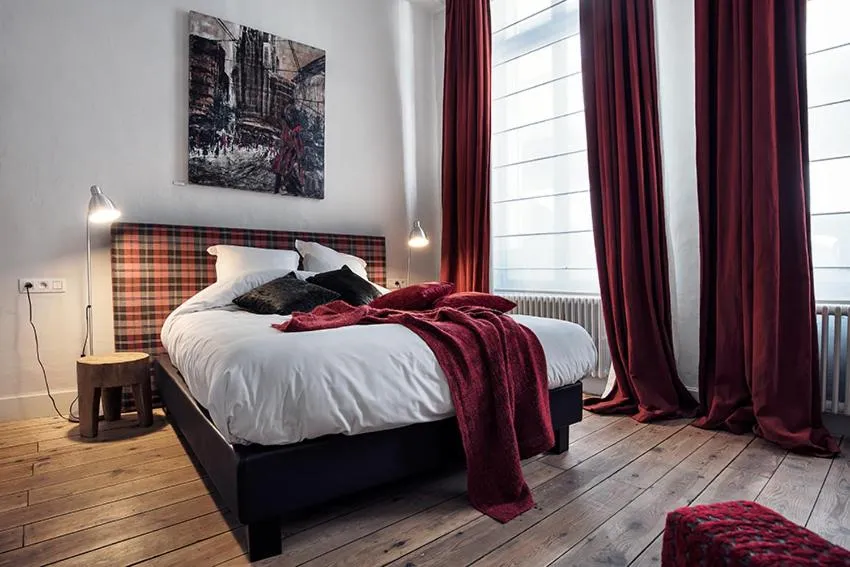 Bed in Ganda Rooms & Suites