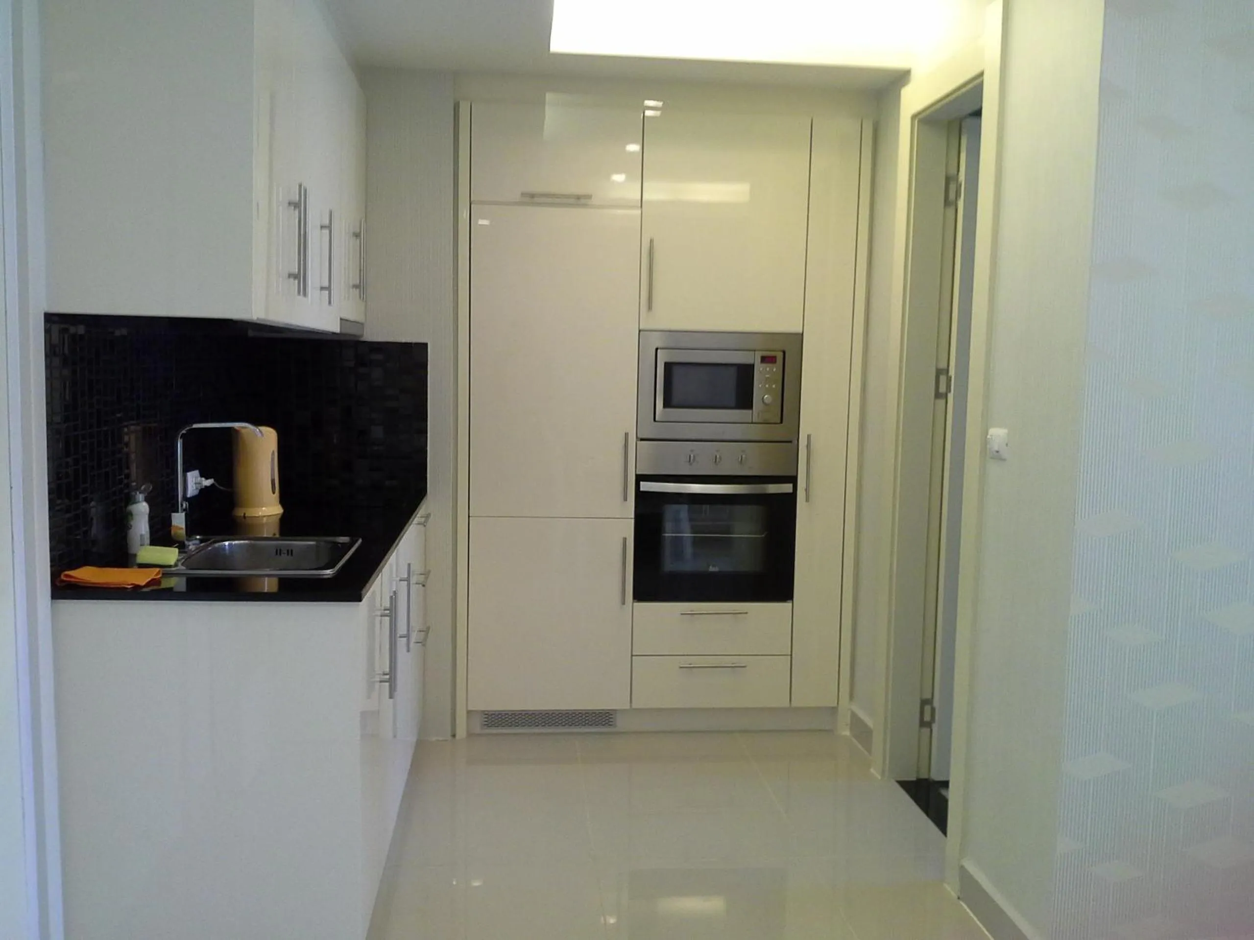 Kitchen or kitchenette in Cosy Beach View Apartments