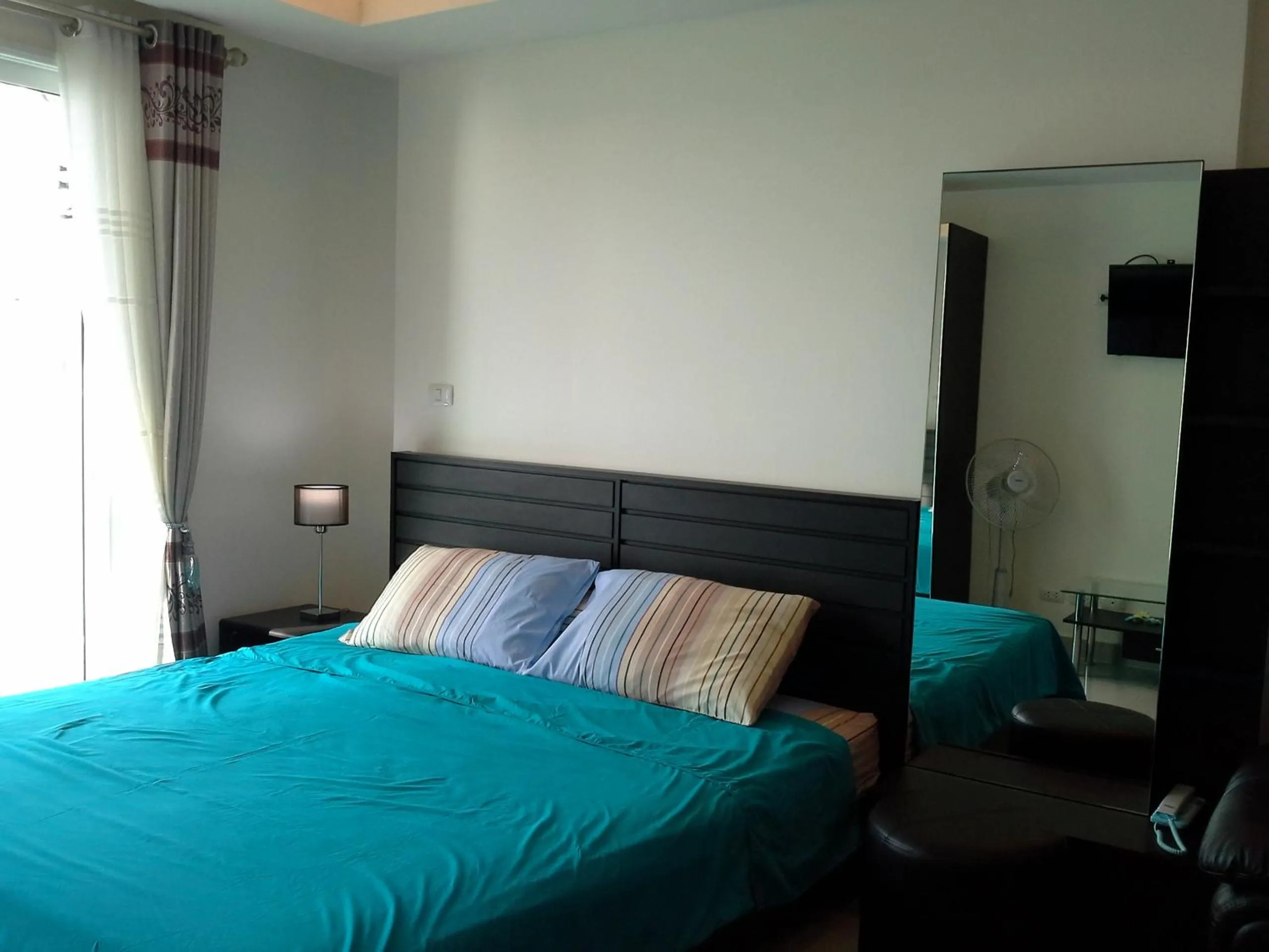 Bed in Cosy Beach View Apartments