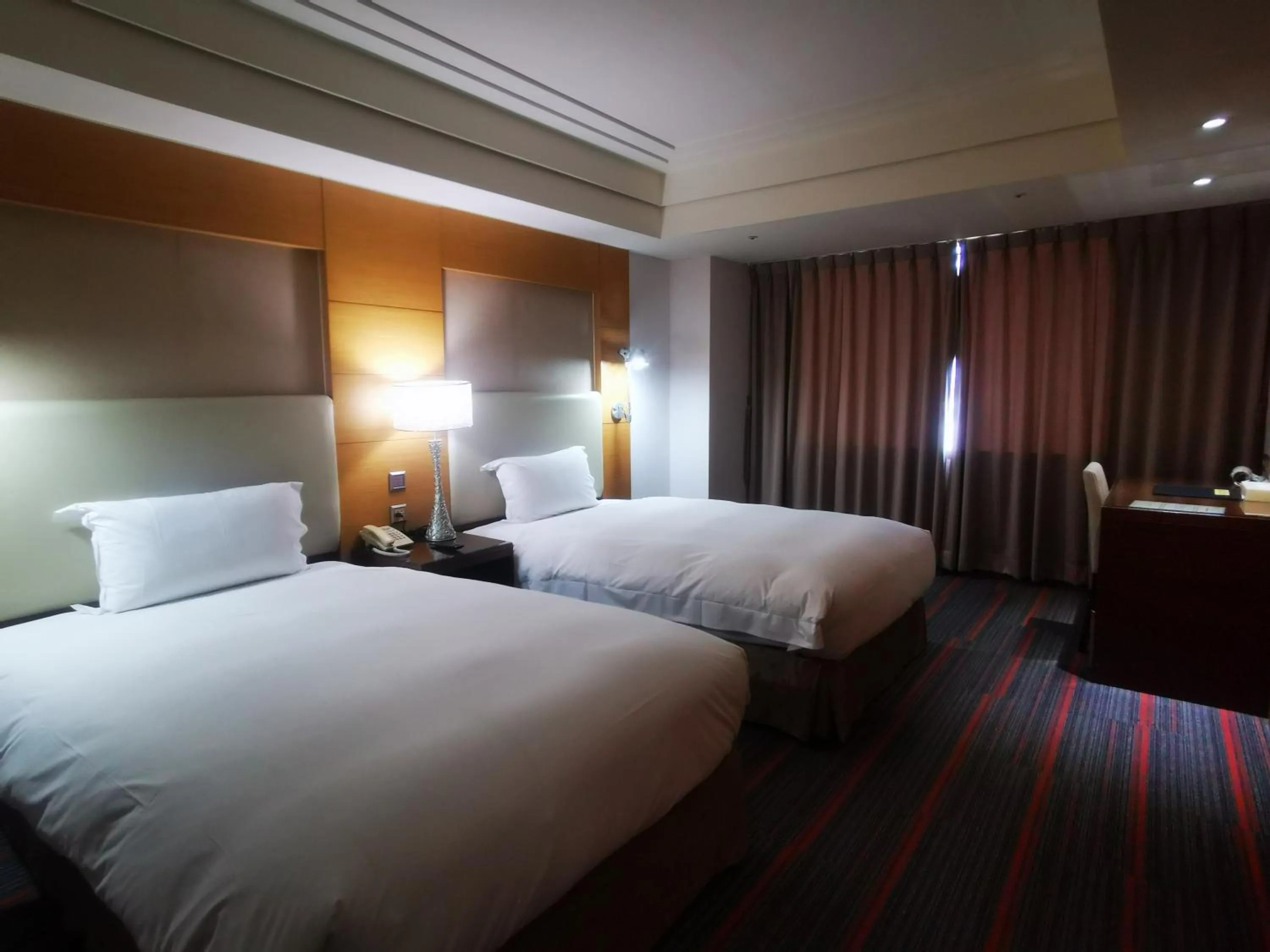 Bed in Ever Delightful Business Hotel