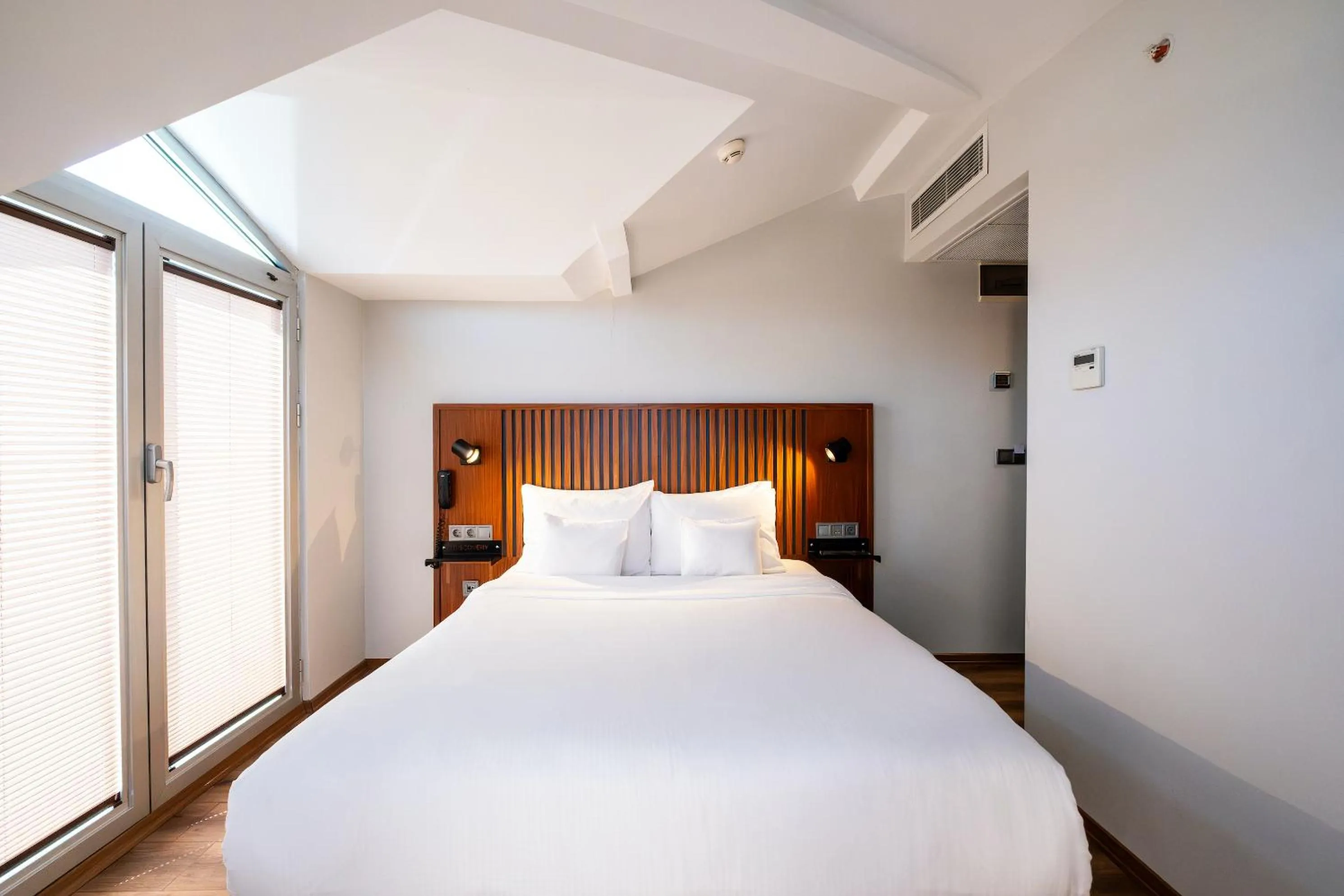 Bed in Discovery Hotel