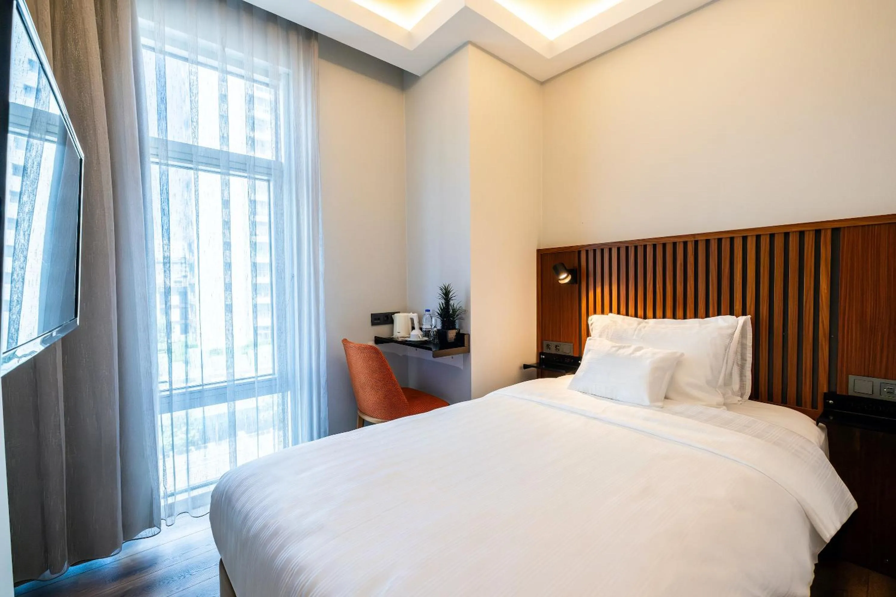 Bed in Discovery Hotel