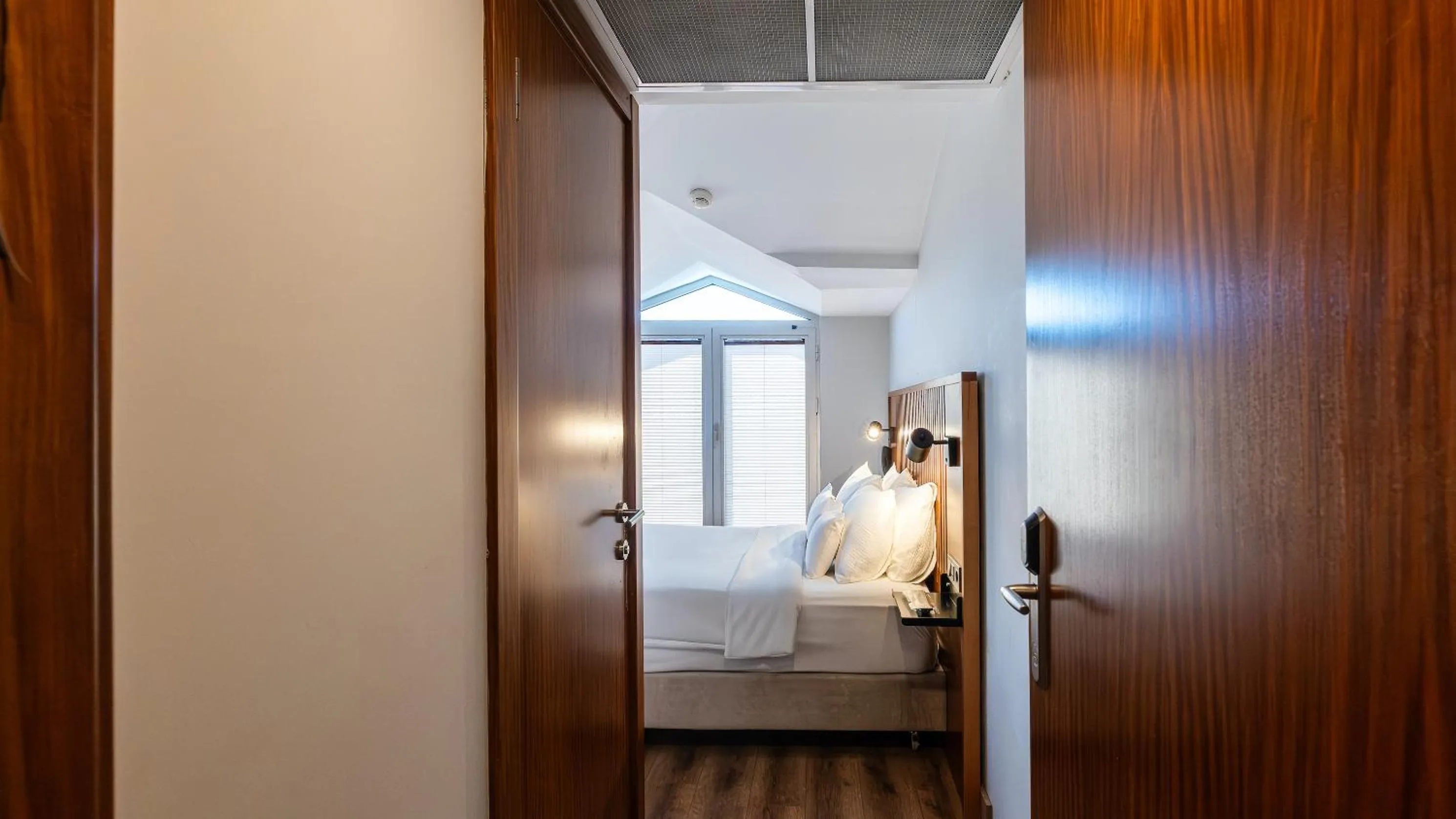 Bed in Discovery Hotel