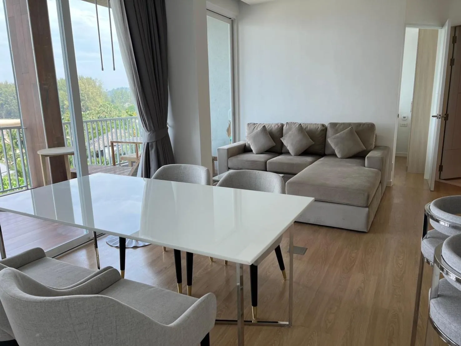 Living room in Beachfront Bliss at Naiyang Phuket by ALPHATEL