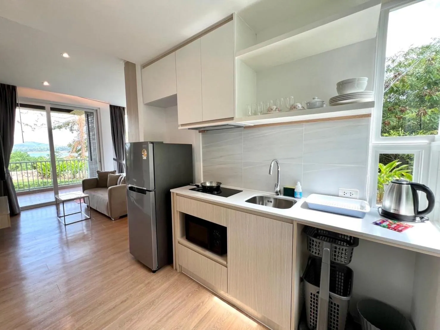 Kitchen or kitchenette in Beachfront Bliss at Naiyang Phuket by ALPHATEL