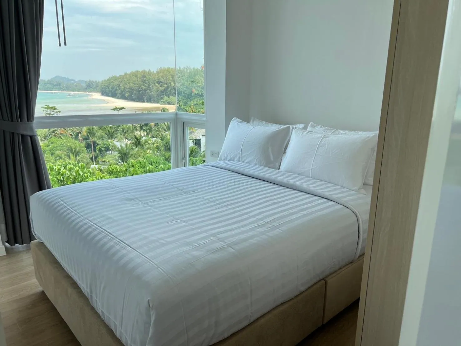 Bed in Beachfront Bliss at Naiyang Phuket by ALPHATEL