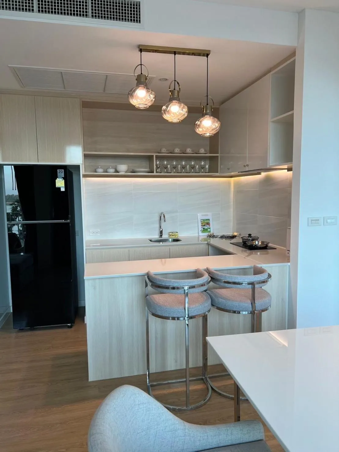 kitchen in Beachfront Bliss at Naiyang Phuket by ALPHATEL