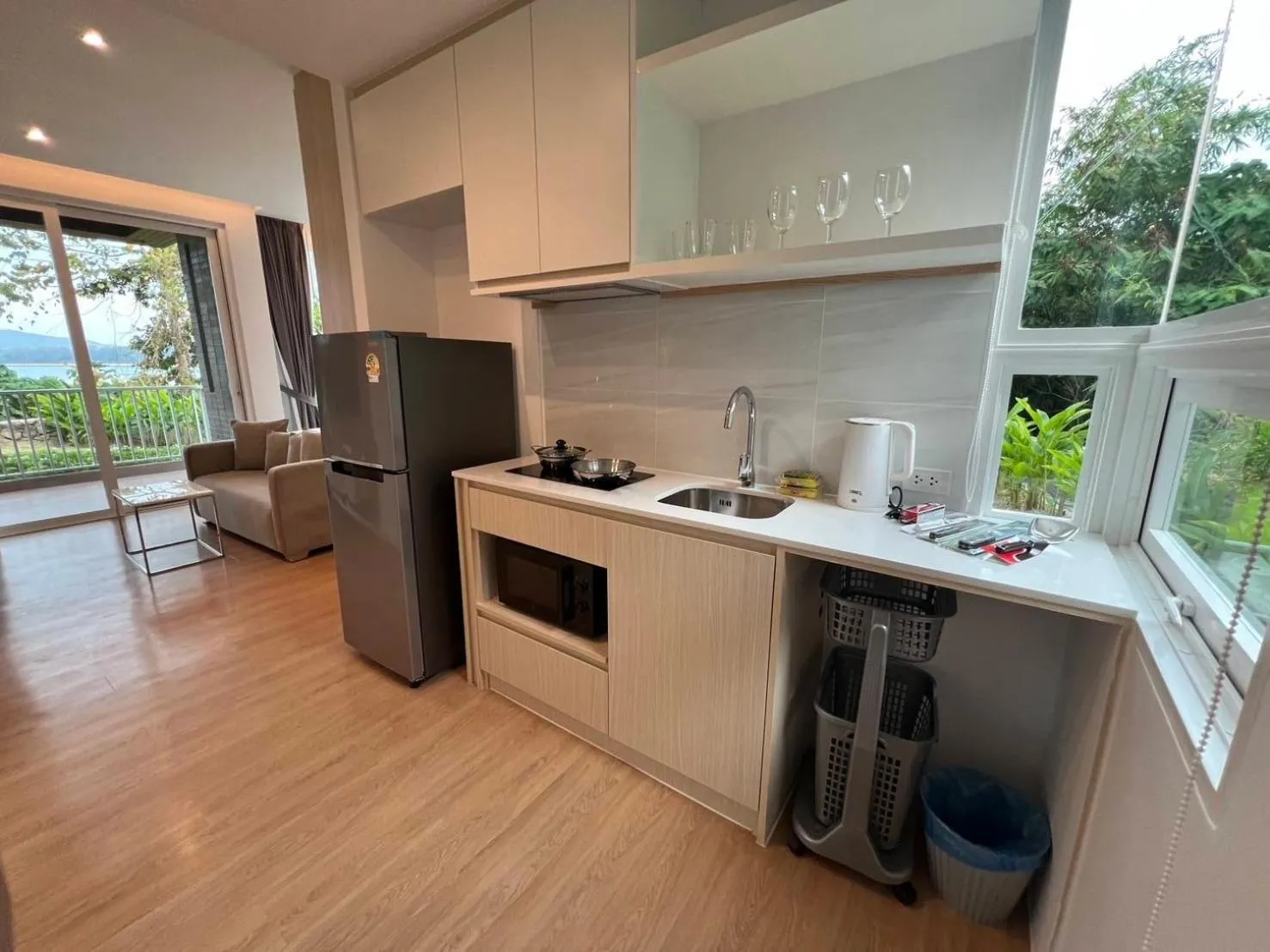 kitchen in Beachfront Bliss at Naiyang Phuket by ALPHATEL
