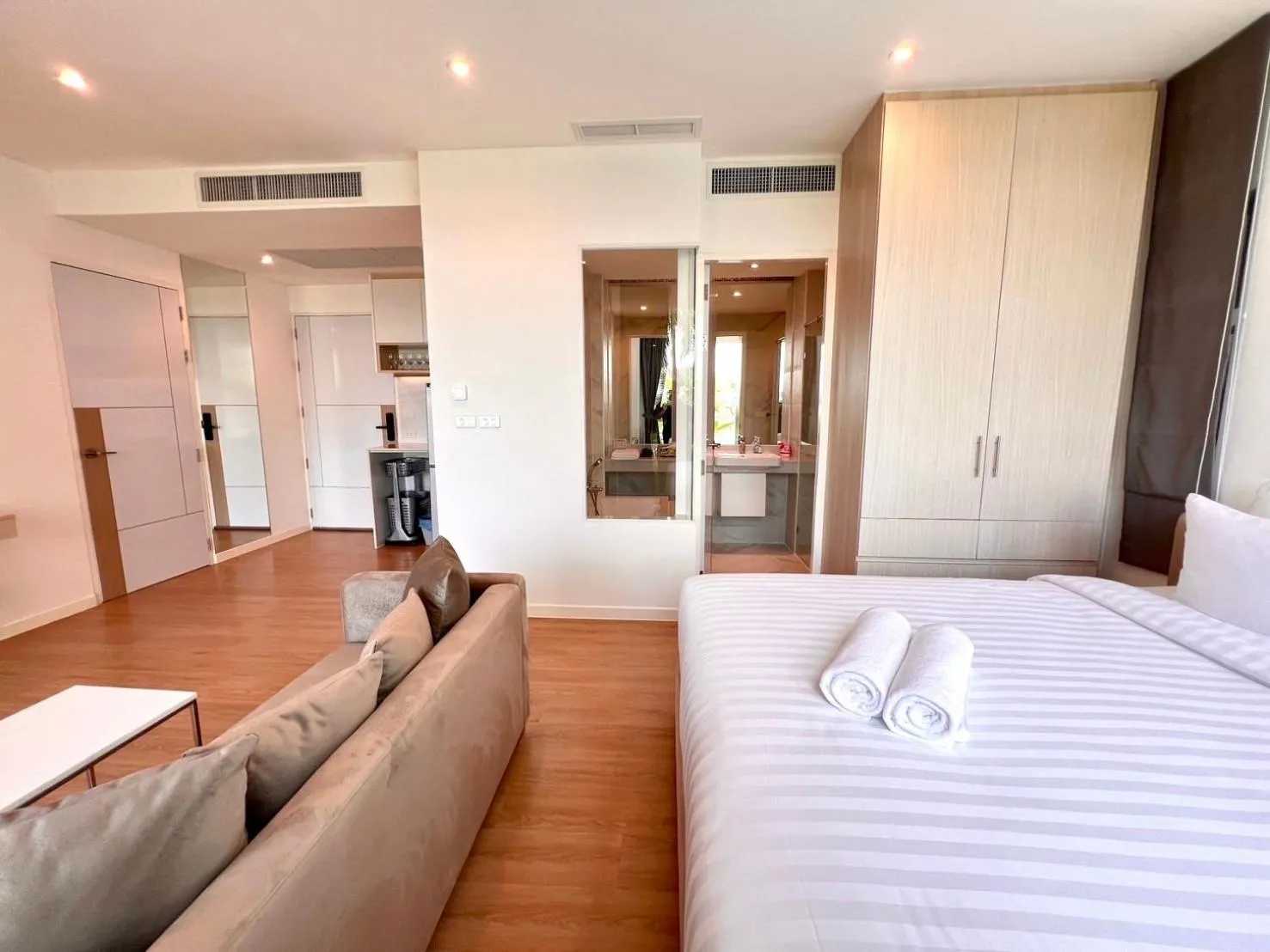 Living room, Bed in Beachfront Bliss at Naiyang Phuket by ALPHATEL