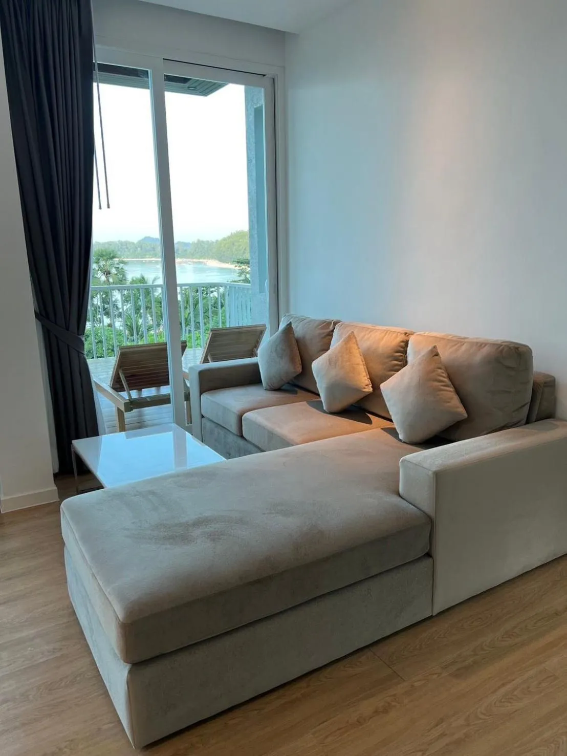 Living room in Beachfront Bliss at Naiyang Phuket by ALPHATEL